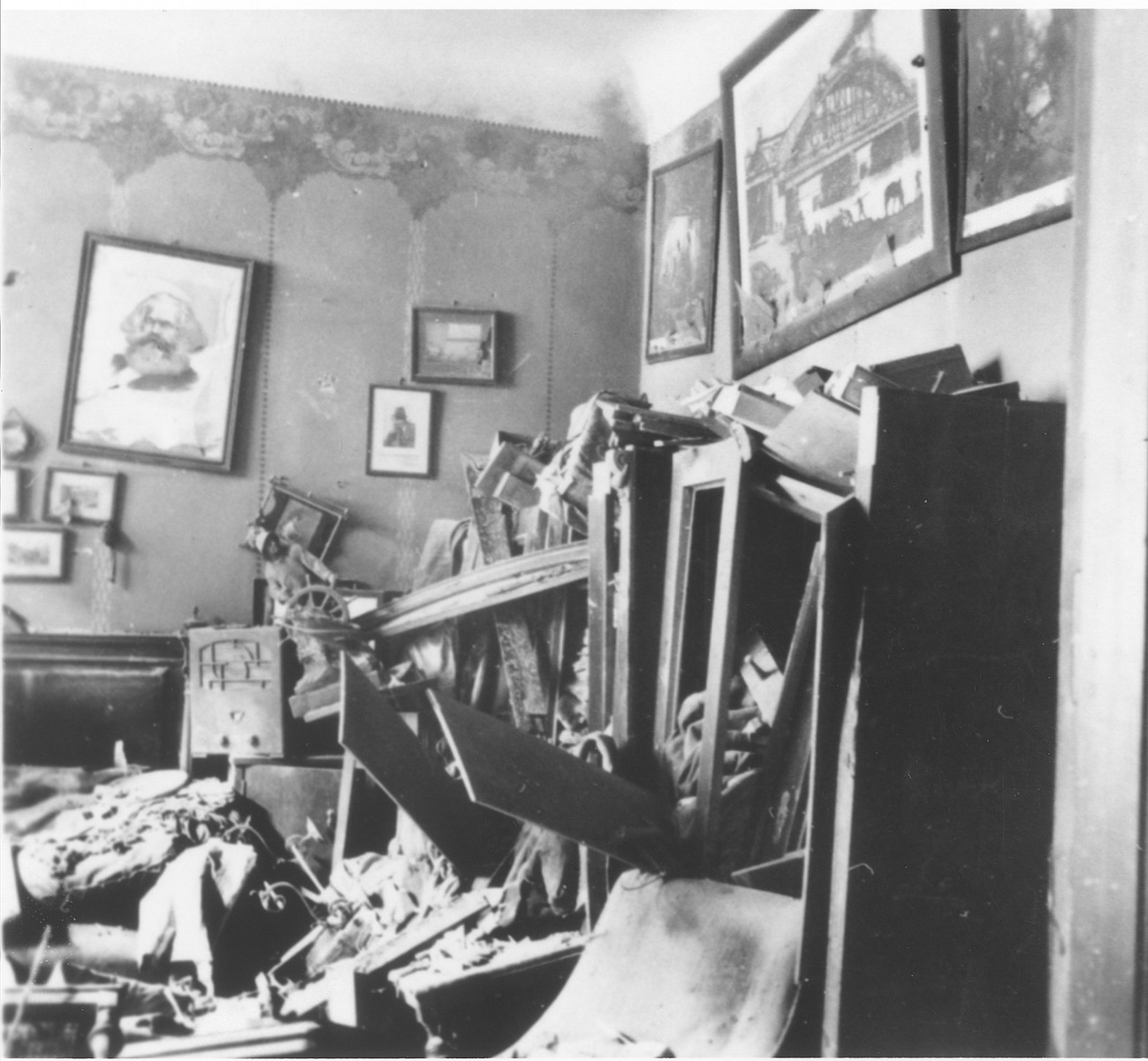 A stereoscoptic image depicting the vandalized apartment of a German worker.  A defaced portrait of Karl Marx hangs on the wall.