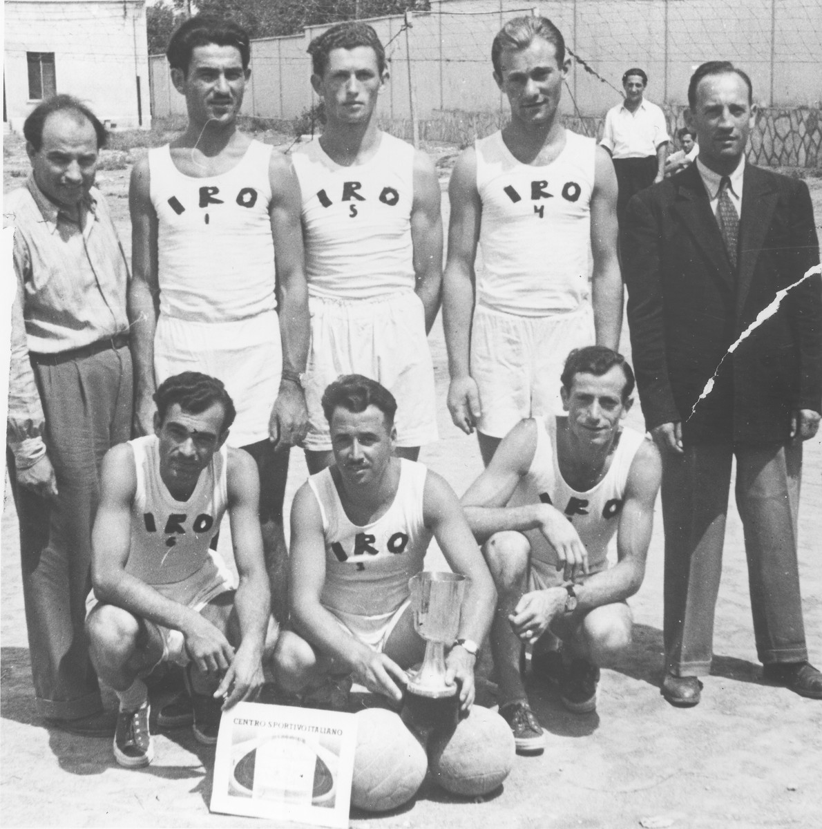 Members of the IRO (International Refugee Organization) volleyball team in the Trani displaced persons camp.

Among those pictured is Ignac Bercovicz (standing third from the left).