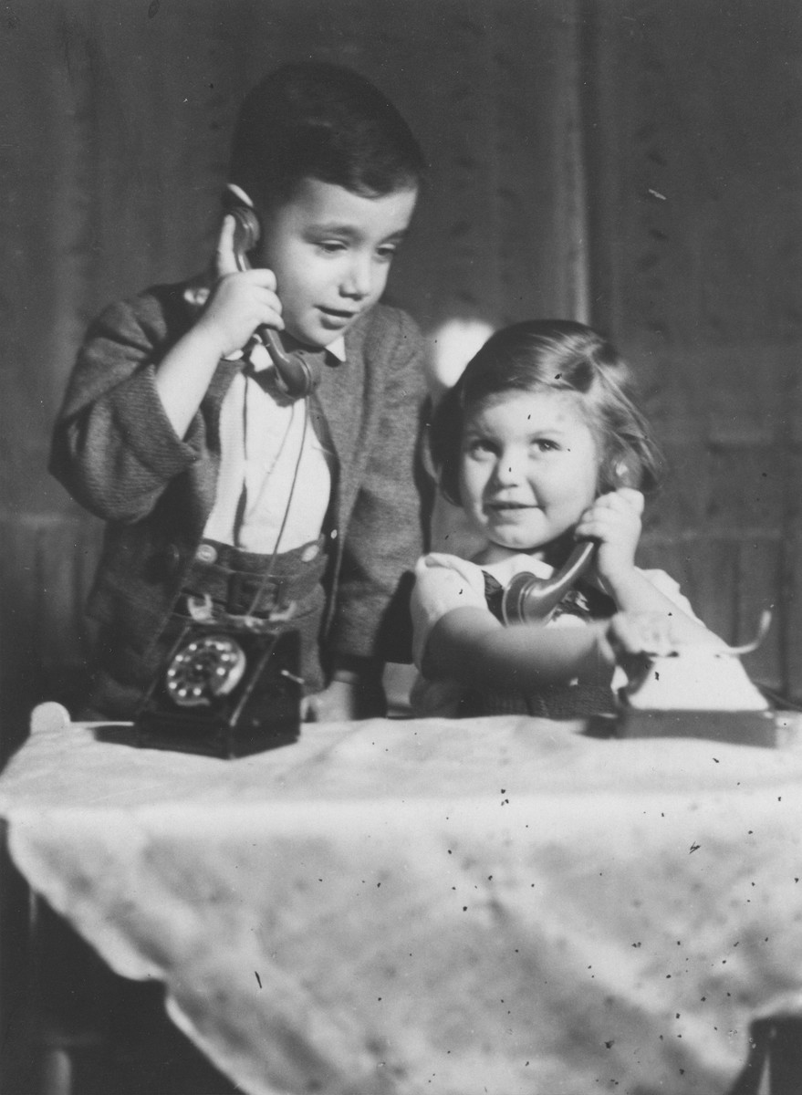 Five-year-old Bedrich Deutsch talks on a toy telephone to his friend Eva Nassau.

Eva Nassau is the daughter of a Jewish lawyer who was a friend of the Deutsch family.  She survived the war.