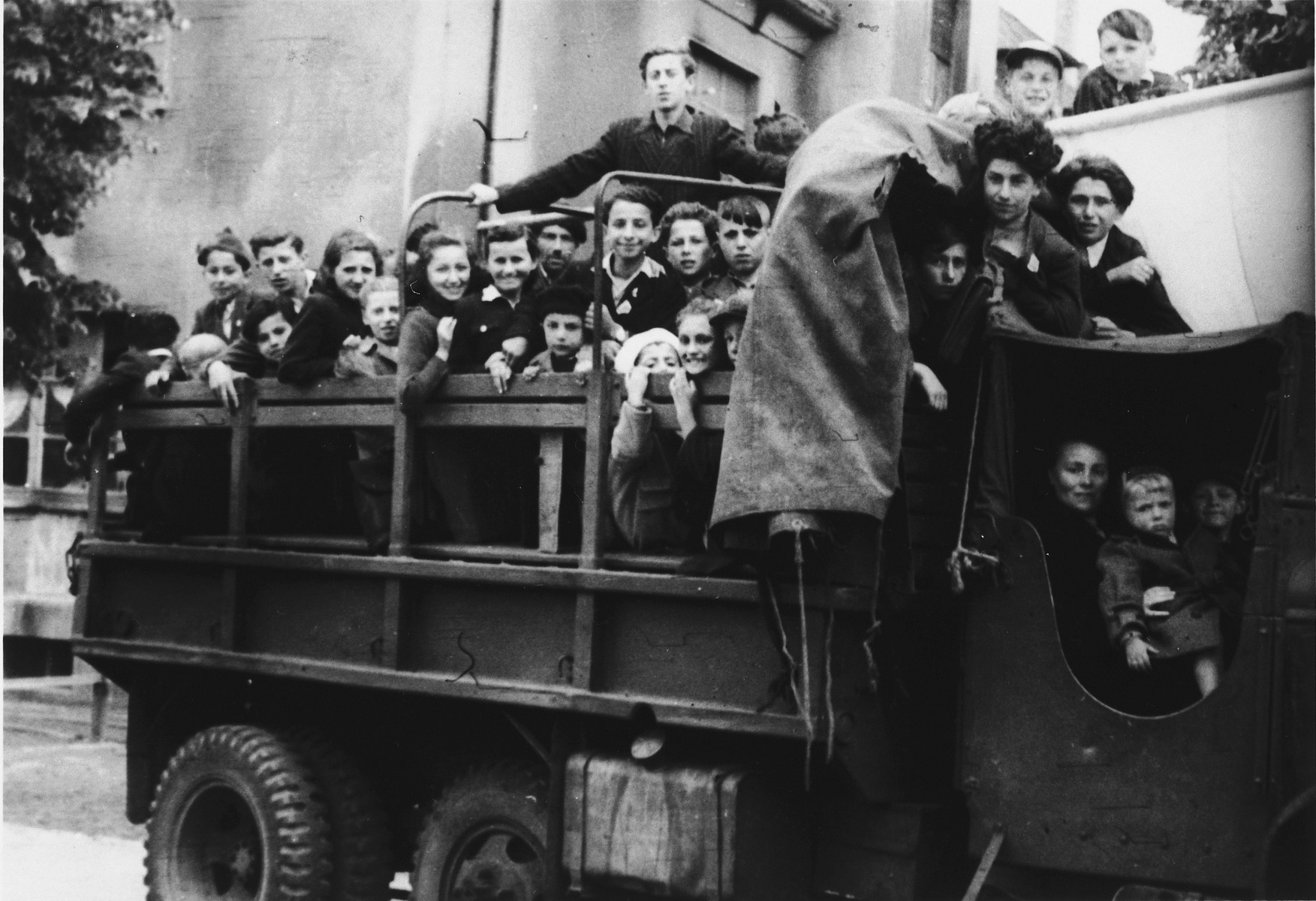 School children from the Eschwege displaced persons' camp board a truck for a Lag B'Omer excursion.