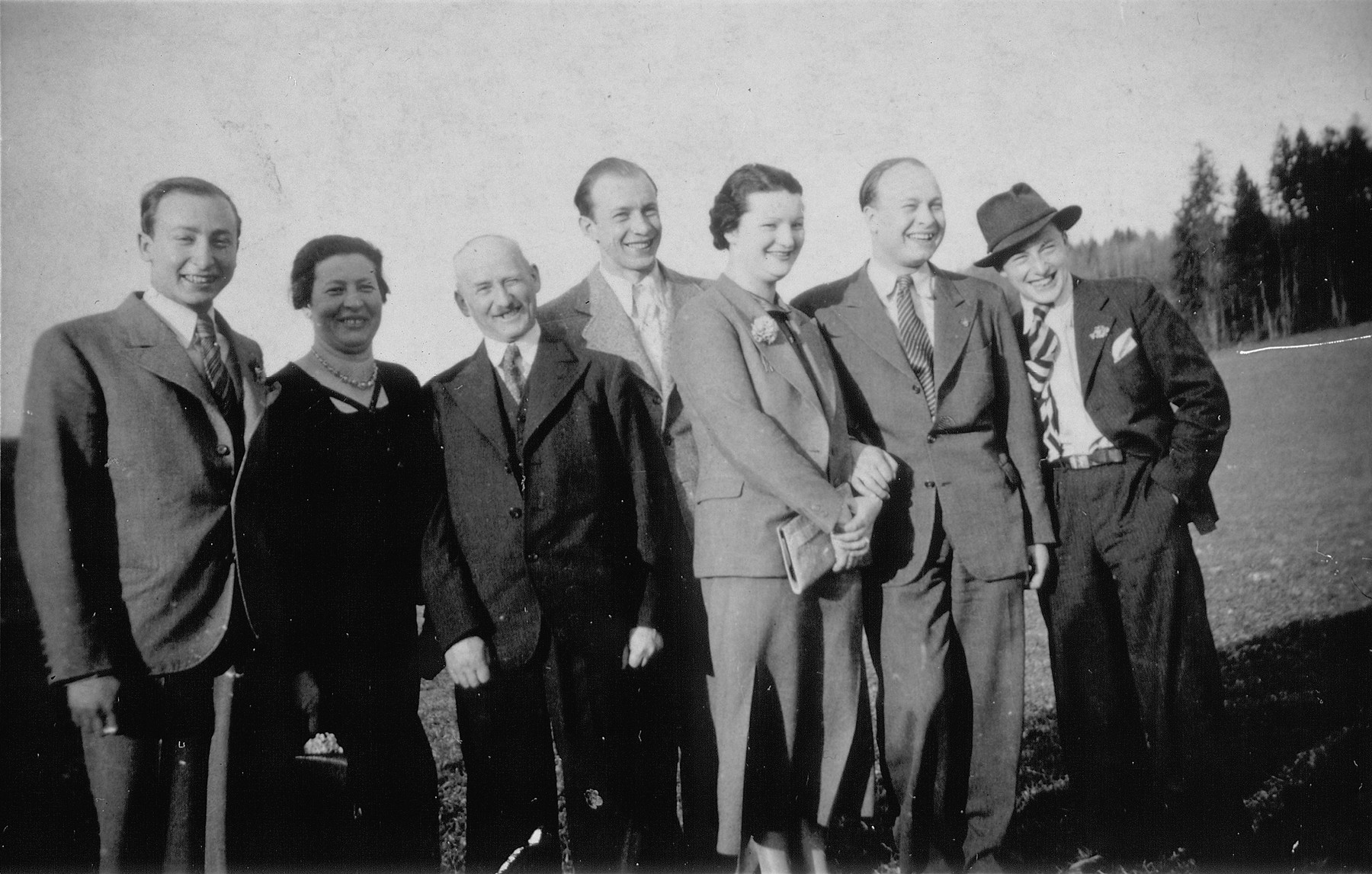 The Blechner family, a Polish-born Jewish family in Germany, poses outside.  

Left to right are Salo, Mina, Markus, Oskar, Friedl, Jakob, and Leo Blechner.