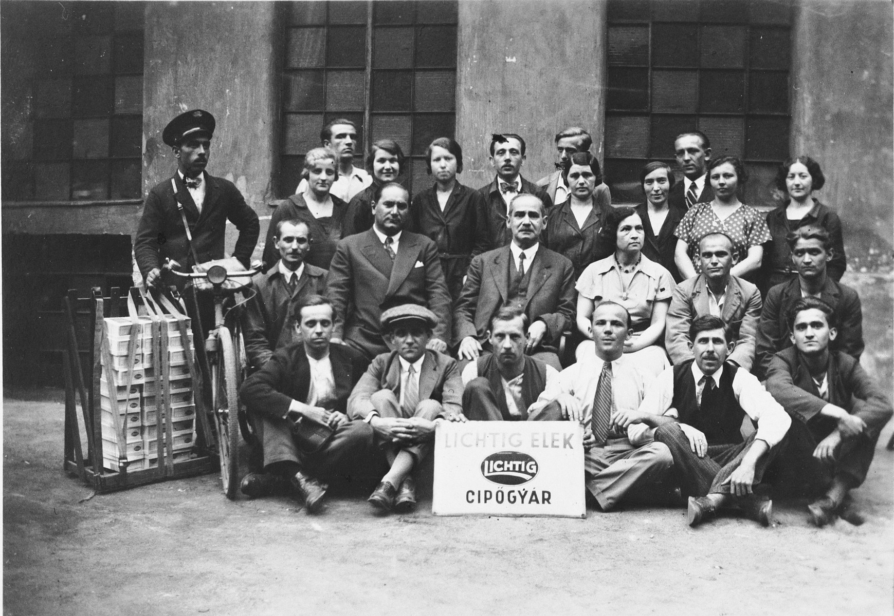 Group portrait of the employees of Elek Lichtig's shoe factory in Budapest, Hungary.