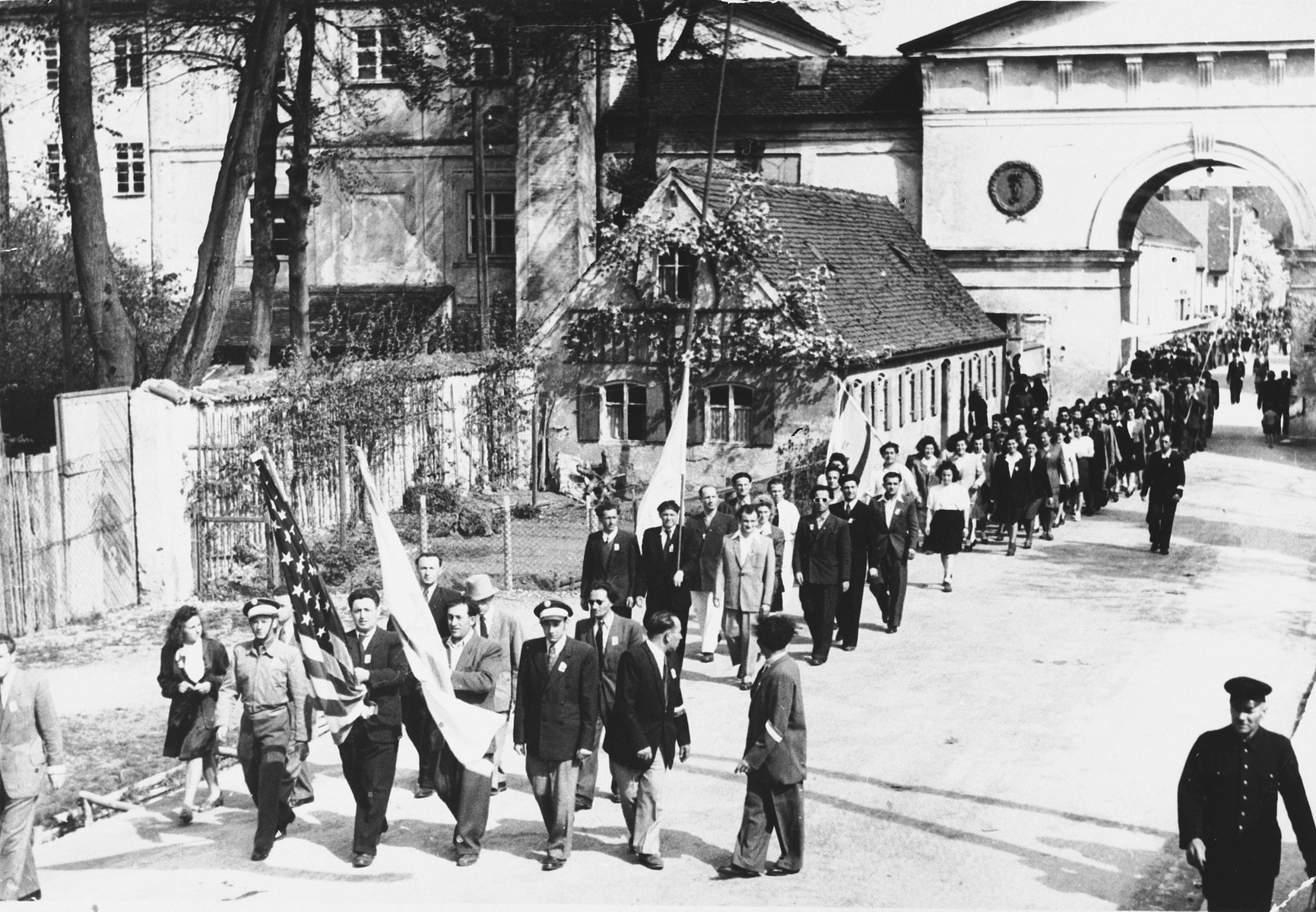 Jewish displaced persons in Tuerkheim march in a memorial parade on the anniversary of the liberation of a concentration camp.