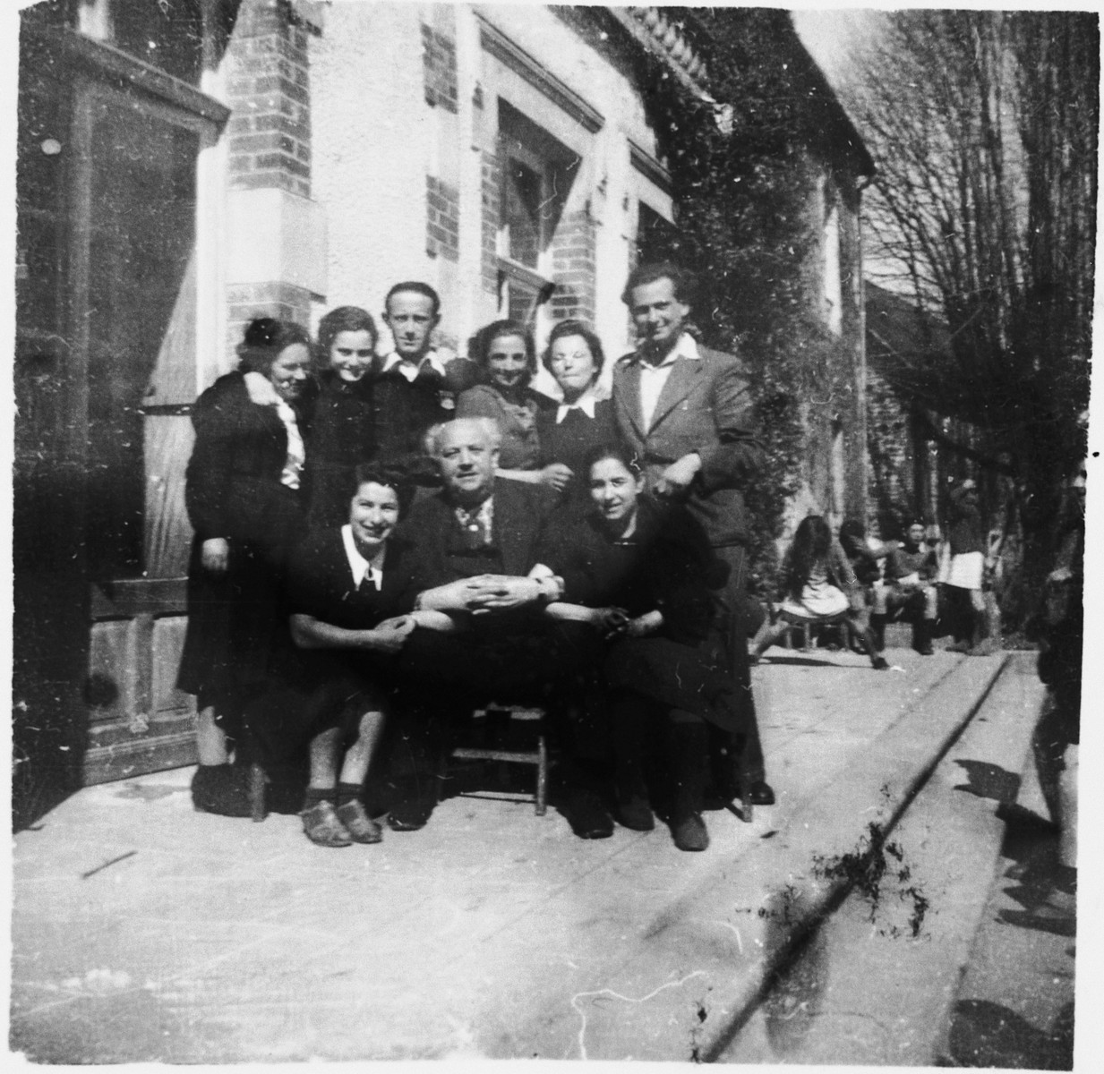 Group portrait of the staff of the Chabannes OSE [Oeuvre de Secours aux Enfants] children's home. 

Standing from left to right are: Gita, Milia, Dr. Meiseles, Ida, Herta and Simon.  Seated are Rachel, Felix Chevrier and Mrs. Sitzman.

Felix Chevrier was honored as Righteous Among the Nations in 1999.