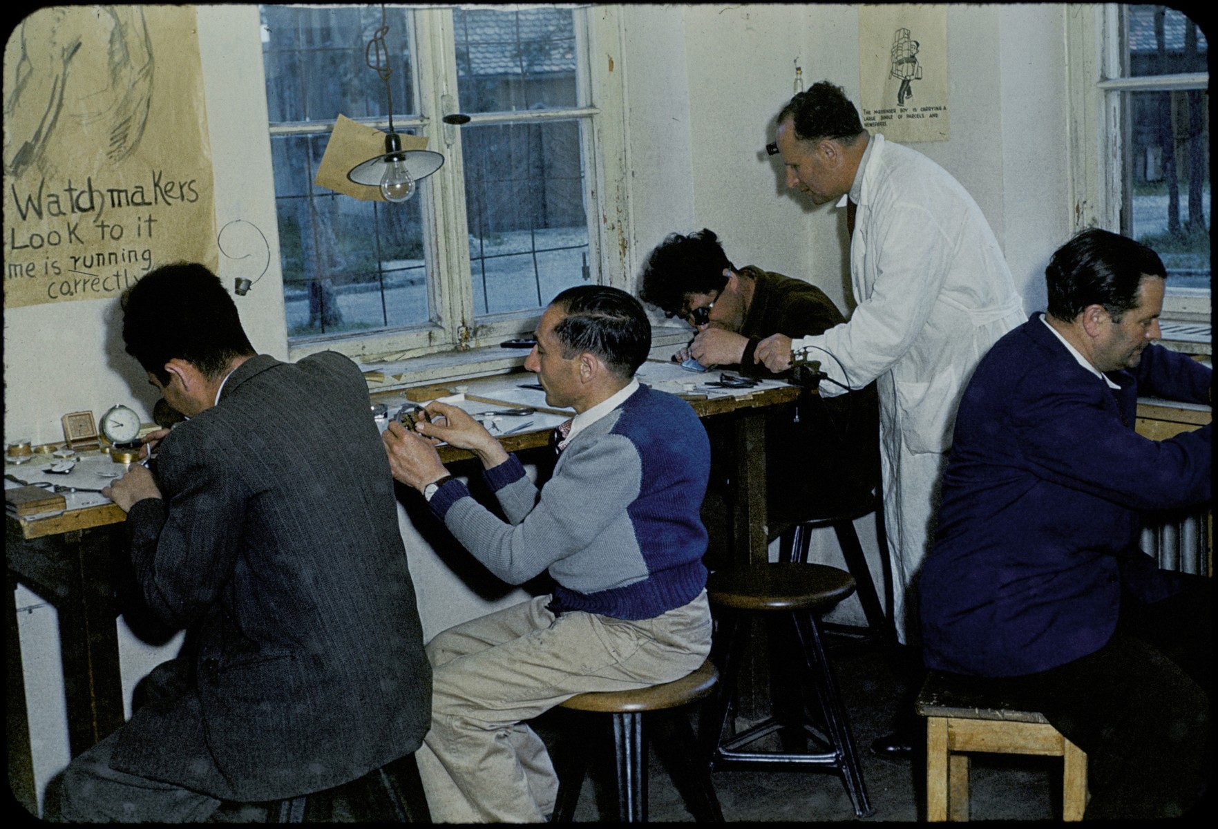 Jewish DPs study watchmaking in the Foehrenwald ORT school.