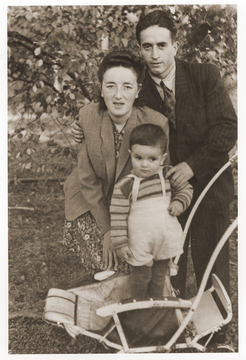 Gerzon and Gittel Trzcina with their son, Benjamin, in the Vilseck displaced persons camp.

Gerzon Trzcina was born in Krasnosielc, Poland in 1922.  He was the son of Dina Kassel and Benam Yitzhak, who was a businessman in the leather trade.  Gerzon had one older brother, Jacob, and two sisters, Faiga (b. 1918) and Perl (b. 1920).  When the war broke out, Gerzon was working as a photographer's assistant (among other jobs) in Warsaw.  Following the German invasion of September, 1939, Gerzon was slightly wounded by shrapnel.  Soon after, a drunken German soldier, forcibly cut Gerzon's hair.  When the soldier made him stoop down to pick up the cuttings, Gerzon grabbed the German's gun and ran away.  After a short time in hiding, Gerzon returned to his hometown, where he learned that eighty Jews had been murdered in the synagogue during the first week of the war in one of the first large-scale atrocities against Polish Jews.  Among those killed was Gerzon's eighty-two-year-old grandfather, Haskel Kassel.  Gerzon moved on to Makow Mazowiecki, where he was forced to clean the stables the Germans had set up in the town's synagogue.  In the late fall, Gerzon escaped with his family to Bialystok, where he worked in a tannery until the family was deported to the Soviet interior in June, 1940.  Along with a group of Polish and Jewish refugees, the Trzcinas were sent to the Kiltovo labor camp in northern Russia.  Harsh conditions and poor nutrition led to Gerzon's father's death in the camp.  The family remained in Kiltovo until the German invasion of the Soviet Union in June of 1941.  Soon after, the refugees were allowed to leave the camp, and the Trzcinas moved to nearby Syktyvkar (capital of the Komi republic), where Gerzon worked in a construction company and later in a tannery.  In Syktyvkar, Gerzon was reunited with Gittel Blankitner, a Jewish refugee from Mlawa, whom he had met earlier in his travels in the Soviet Union.  (Gittel's father perished in Aushwitz, and her mother and siblings were killed in Treblinka.) In November, 1944, Gerzon and Gittel were married. The couple left the Soviet Union with their new baby in 1946.  Returning for a brief time to Poland, the family soon joined the wave of survivors streaming toward the Western zones of occupation.  After their arrival in Germany, the Trzcinas stayed in several DP camps including Vilseck, Wurzburg and Lechfeld, where Gerzon worked as an UNRRA photographer.  In March 1951, the family immigrated to the United States.