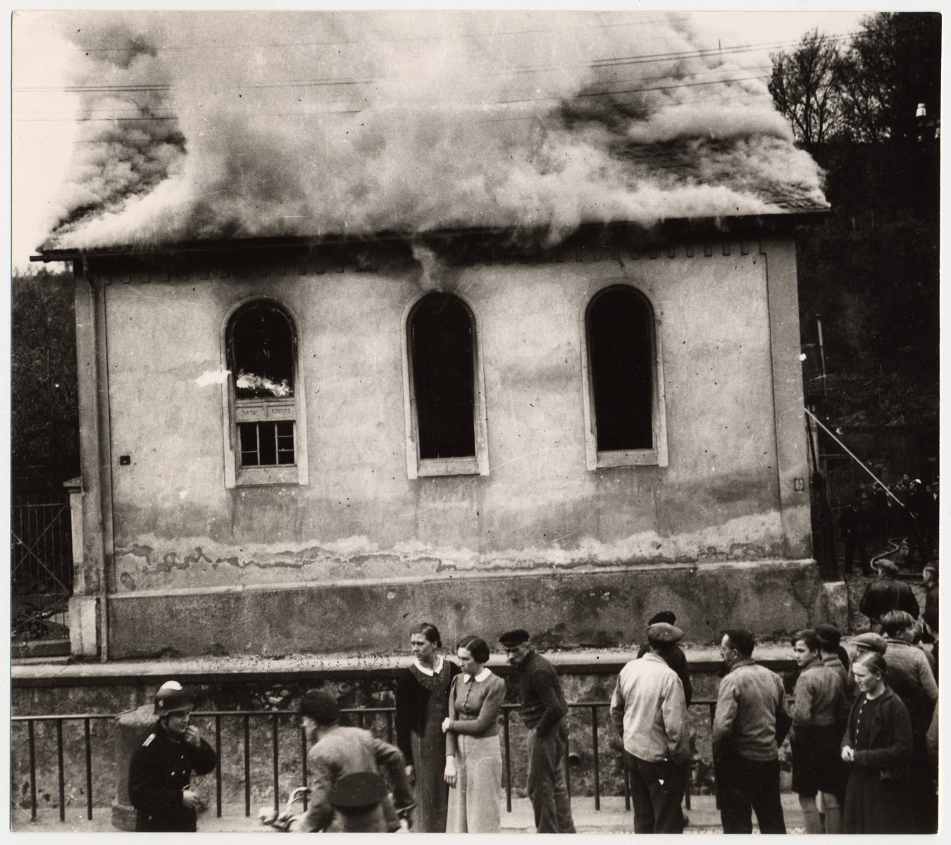 On the morning after Kristallnacht local residents watch as the Ober Ramstadt synagogue is destroyed by fire.   The local fire department prevented the fire from spreading to a nearby home, but did not try to limit the damage to the synagogue.

The youth who took the series of photographs of the burning synagogue in Ober-Ramstadt, Georg Schmidt,  came from a family that opposed the Nazis.  The film was confiscated by police from Schmidt's home the same day the photos were taken, and developed immediately.  The prints and negatives were stored in the city hall until a policeman in the service of the American occupation found them and removed them.  The son-in-law of the policeman found them in a toolbox and donated them to the city archive.