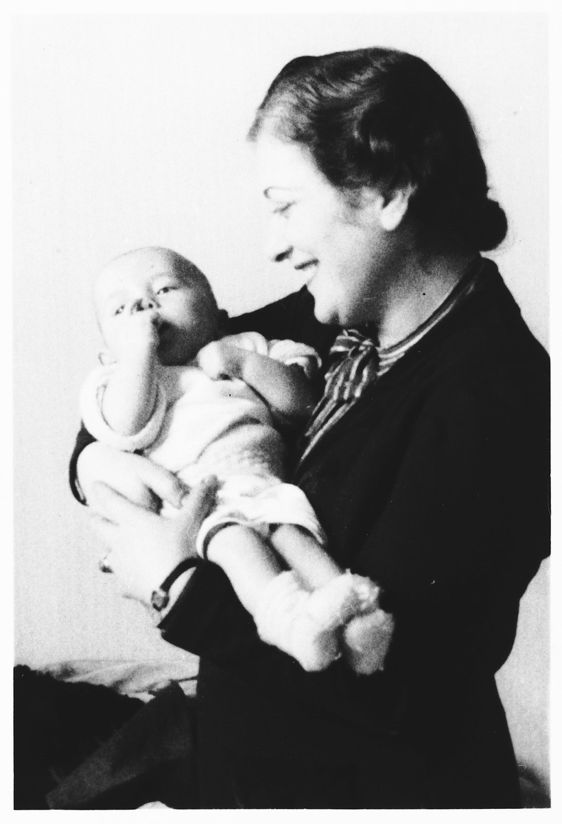 A young Jewish mother, who is living in hiding in German-occupied Belgium, visits her infant son, who is being sheltered at a convent outside Brussels.

Pictured is Lea  Abramowicz with her son, Georges.