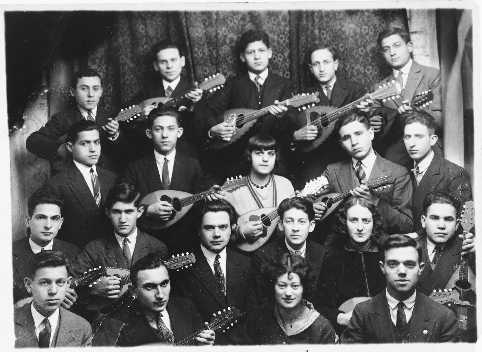 Group portrait of members of a Jewish youth movement mandolin band in Warsaw.  The young men and women belong to the Poale Zion Zionist youth movement.