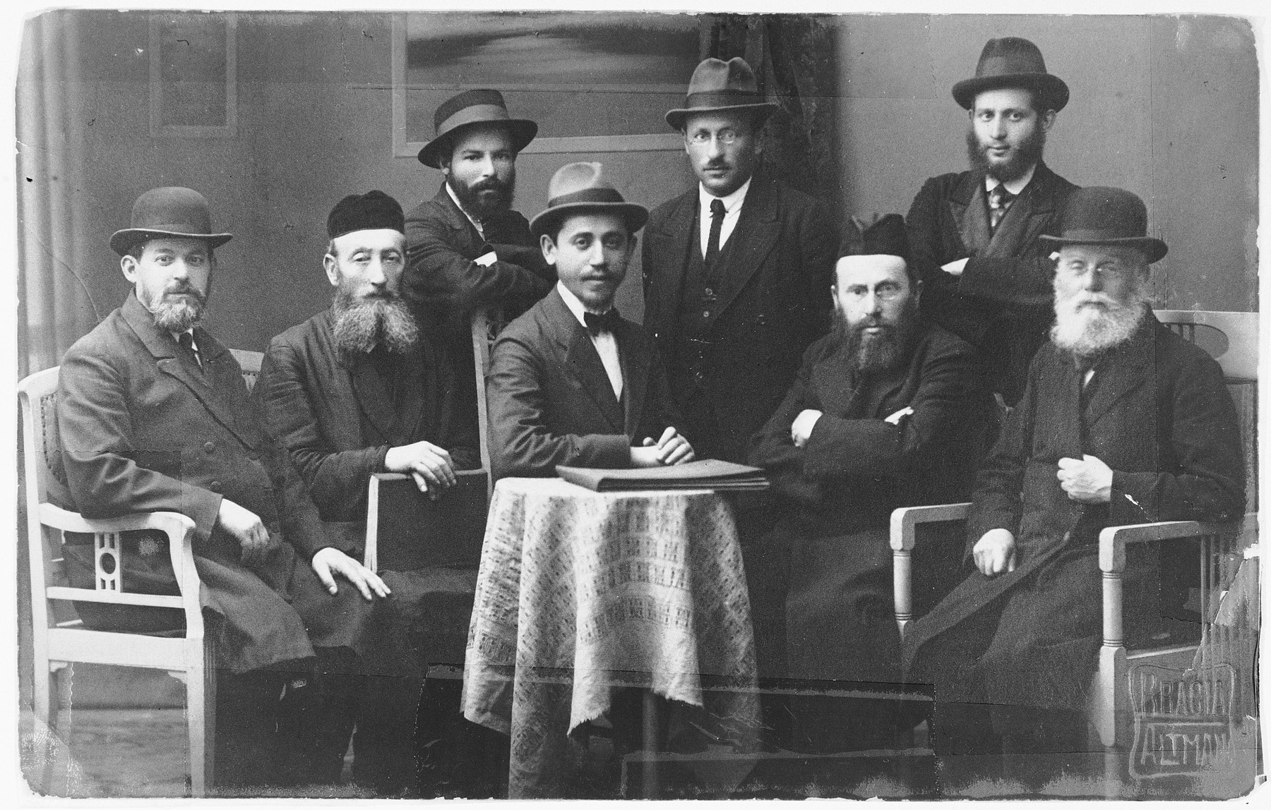Group portrait of religious Jews in Sosnowiec.

Seated first from the right is Yosef Israel Wroncberg who was a rabbinics teacher.

The photo was taken in the studio Stanislas Altman, a Jewish photographer who perished in Auschwitz.