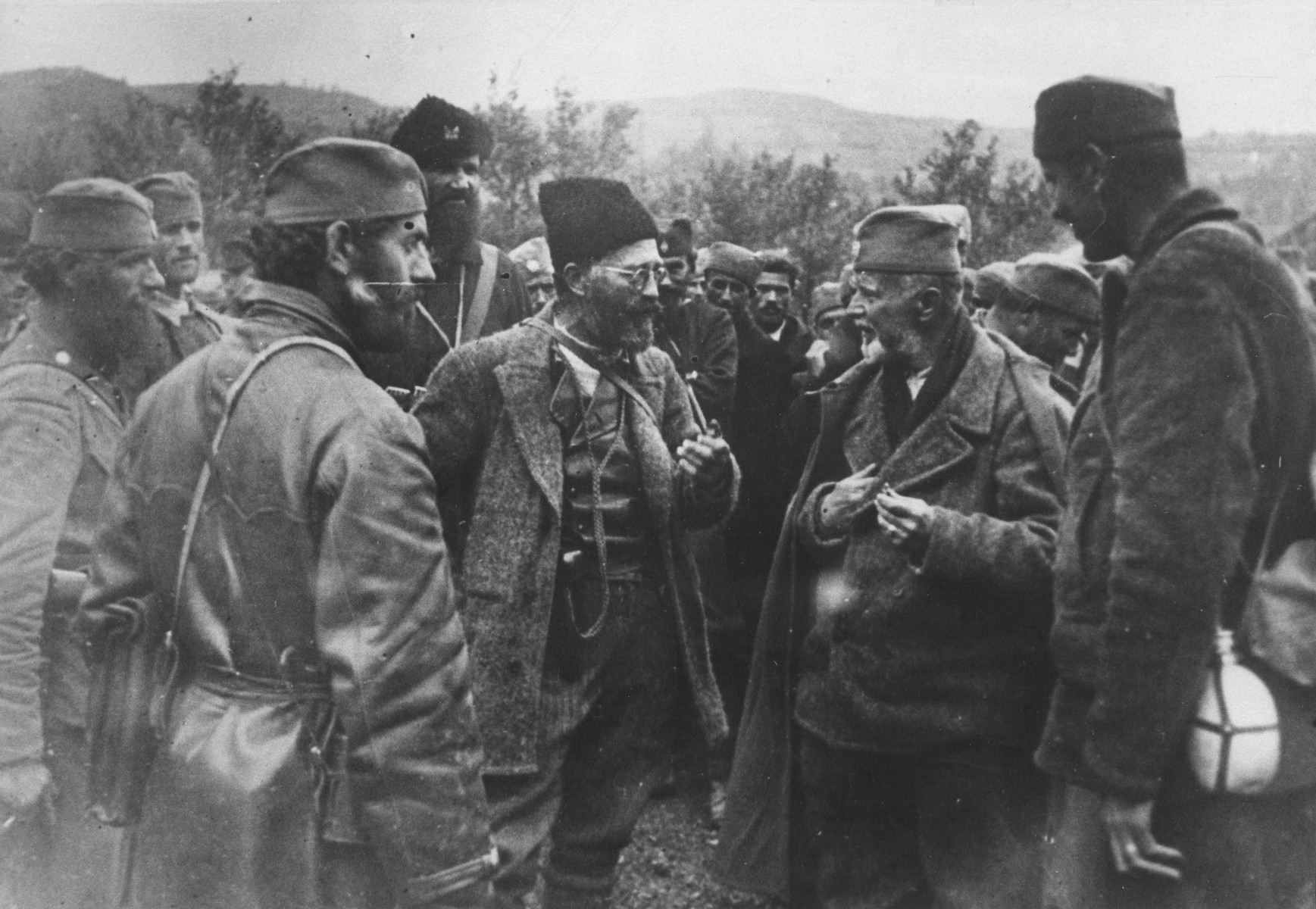 Chetnik leader Draza Mihajlovic confers with his men.