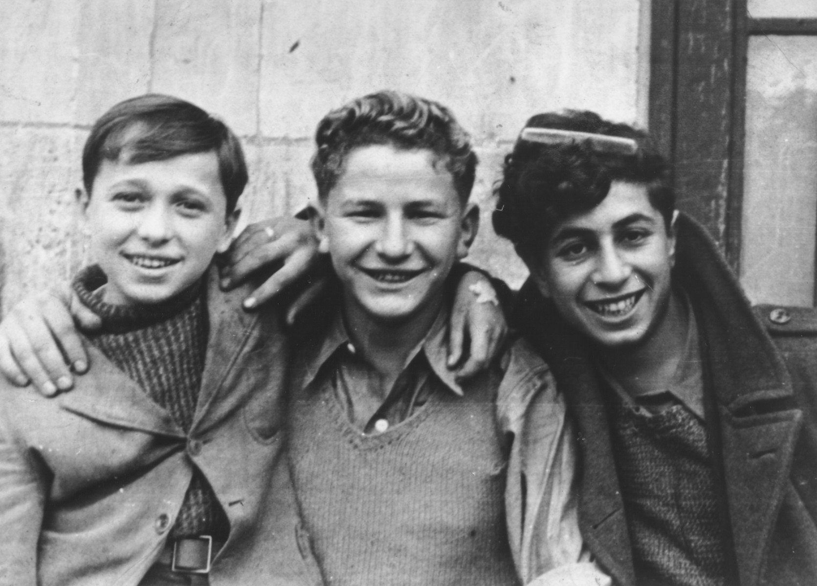 Portrait of three Jewish DP youth at the OSE (Oeuvre de Secours aux Enfants) children's home in Champigny-sur-Marne. 

Pictured from left to right are: Leon Lewkowicz, Johny Weisz and Ignatz Spett.