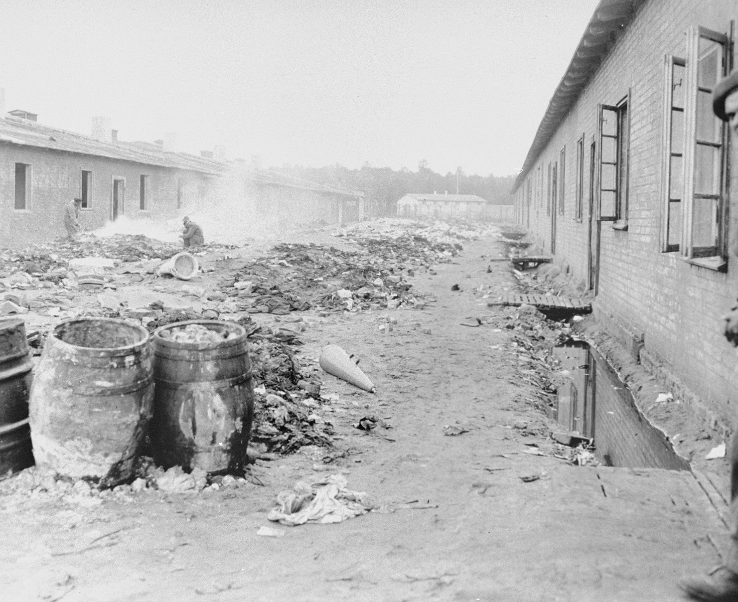 A refuse-filled yard between barracks in Bergen-Belsen concentration camp.