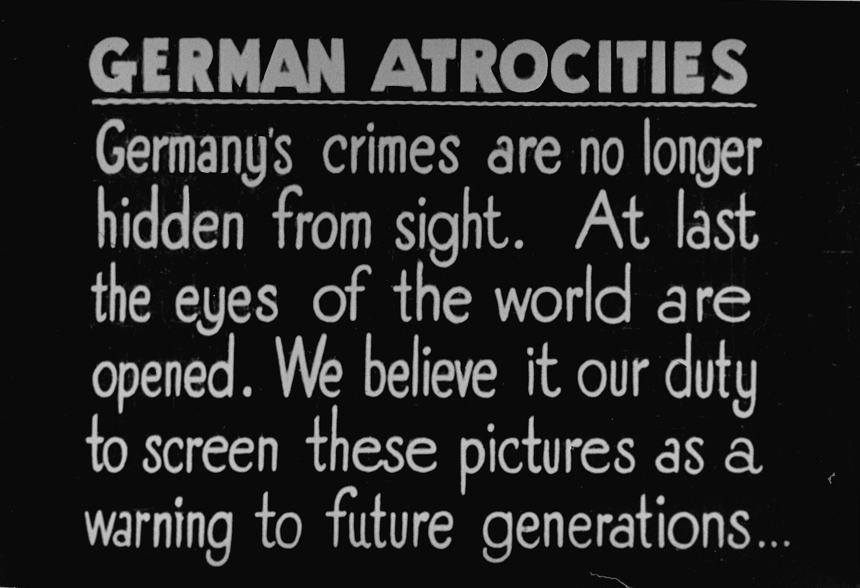A British Army sign that was posted with a photo display intended to show German civilians from surrounding towns the atrocities committed in Bergen-Belsen concentration camp.