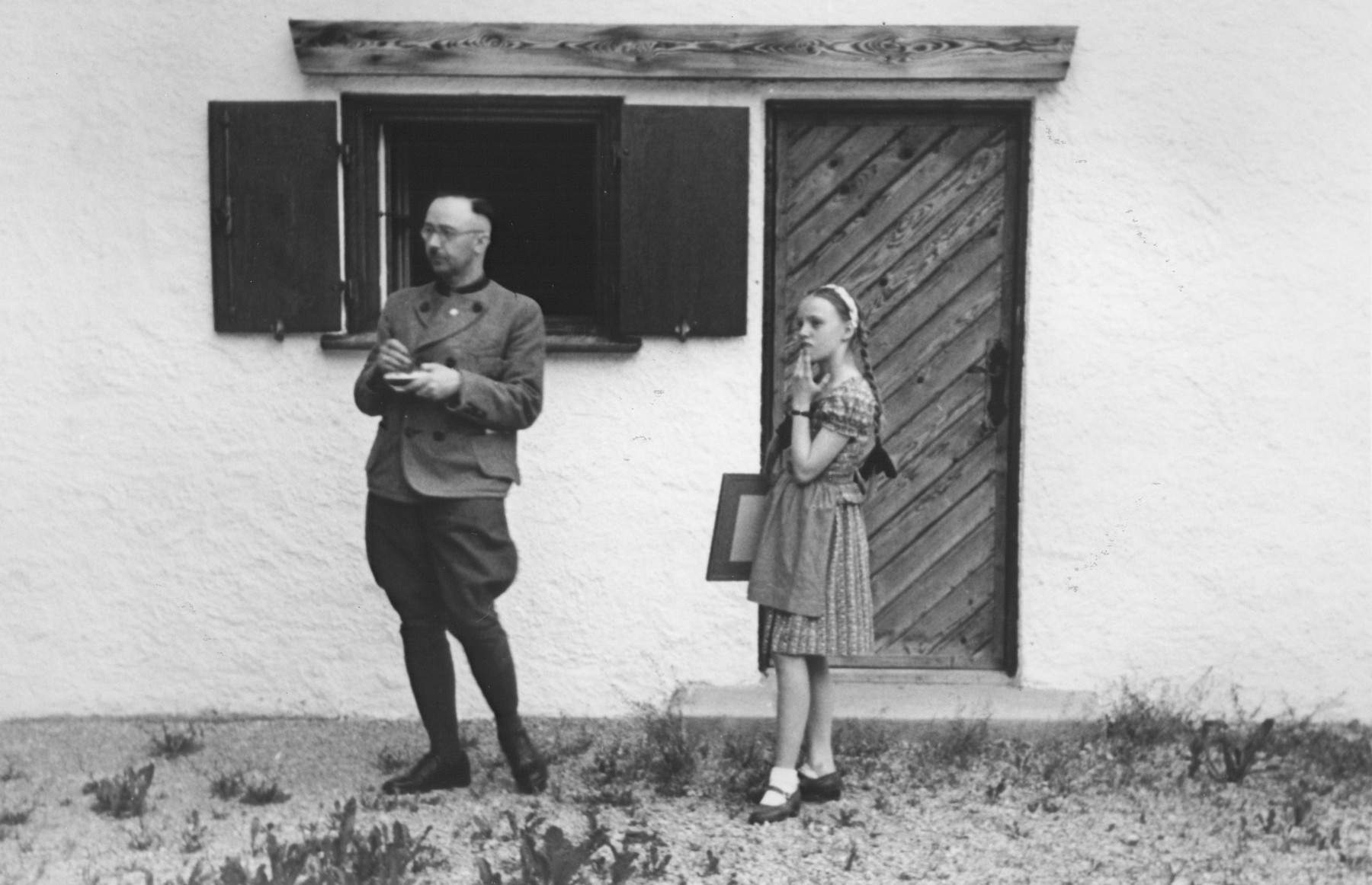 Heinrich Himmler with his daughter Gudrun in front of their home in Gmund am Tegernsee.