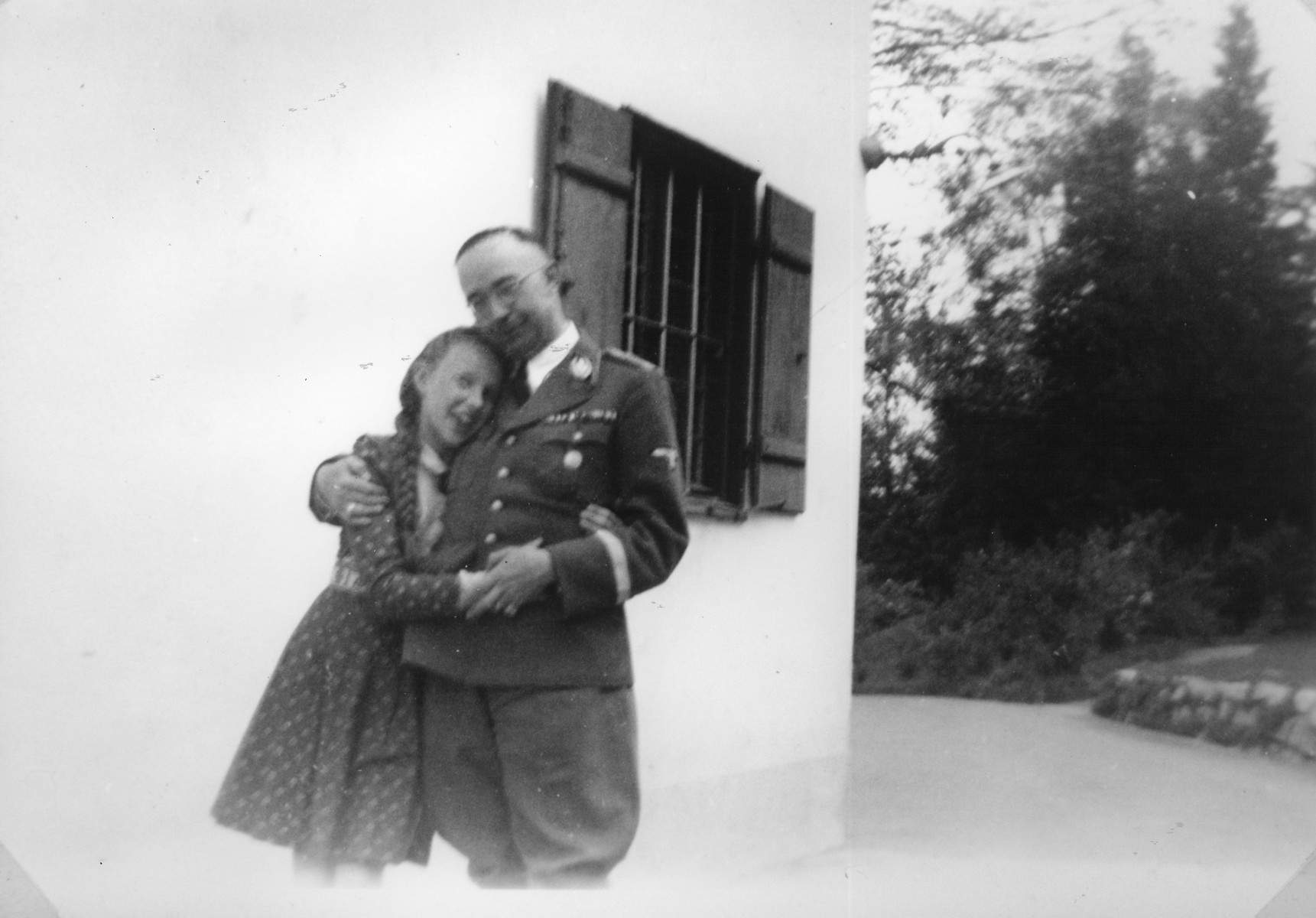 Reichsfuehrer-SS Heinrich Himmler embraces his daughter Gudrun [probably outside their home in Gmund am Tagernsee].