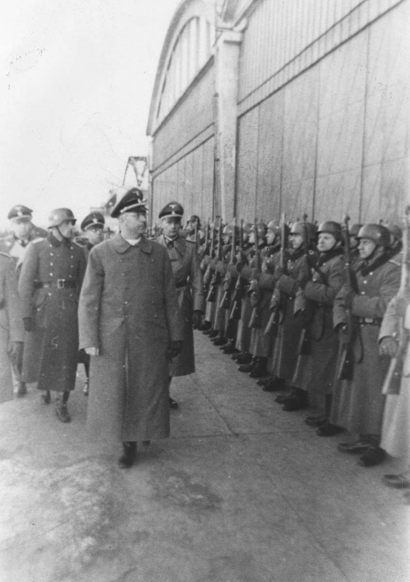 Reichsfuehrer-SS Heinrich Himmler reviews a unit of SS-police in Krakow in the company of Friedrich- Wilhelm Krueger.

Later that evening, Himmler met with General governor Hans Frank.  At that meeting, Himmler communicated the message that by the end of 1942 half of all Jews in the General Government will be murdered.  The following day, March 14, deportation actions to the Belzec killing center began in the ghettos of Lvov and Lublin. [Himmler Dienstkalender, pp. 378-79]