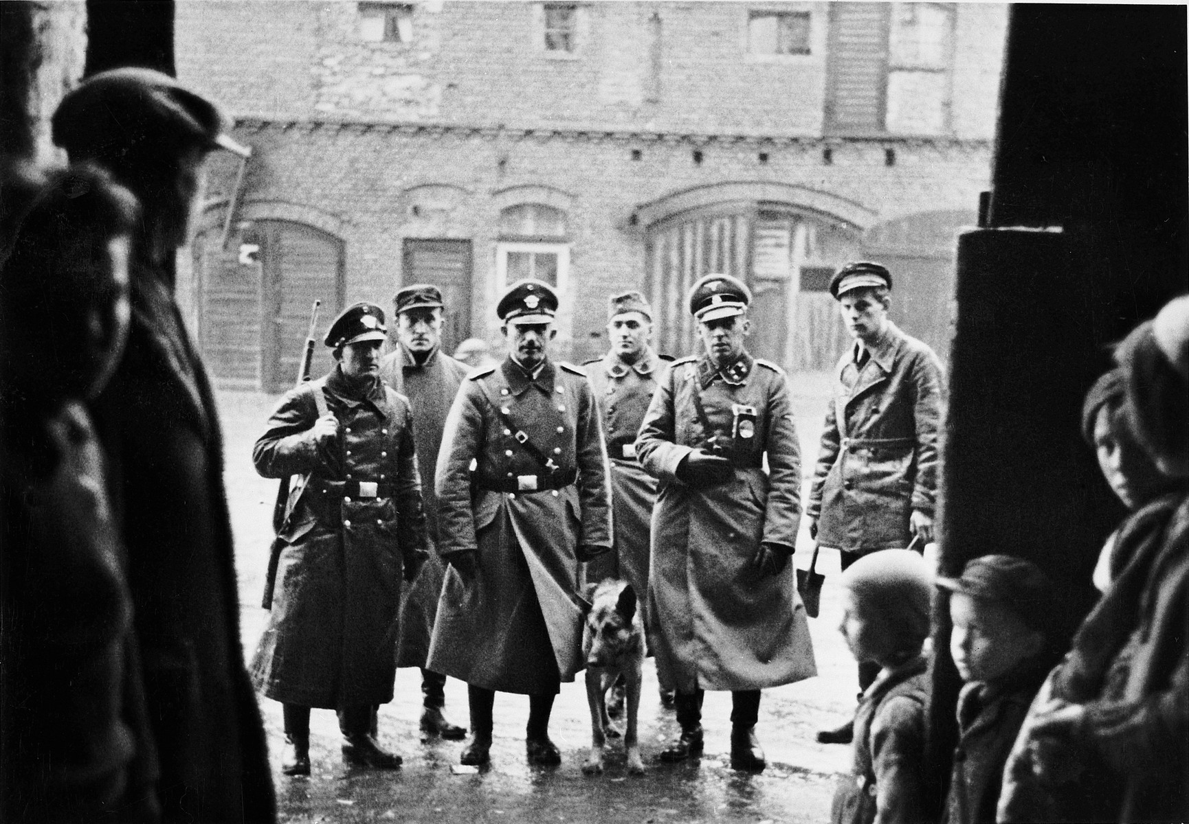 A group of SS, police, and ethnic German auxilliaries prepare to conduct a search during the "pacification" of Bydgoszcz in the opening months of the war.