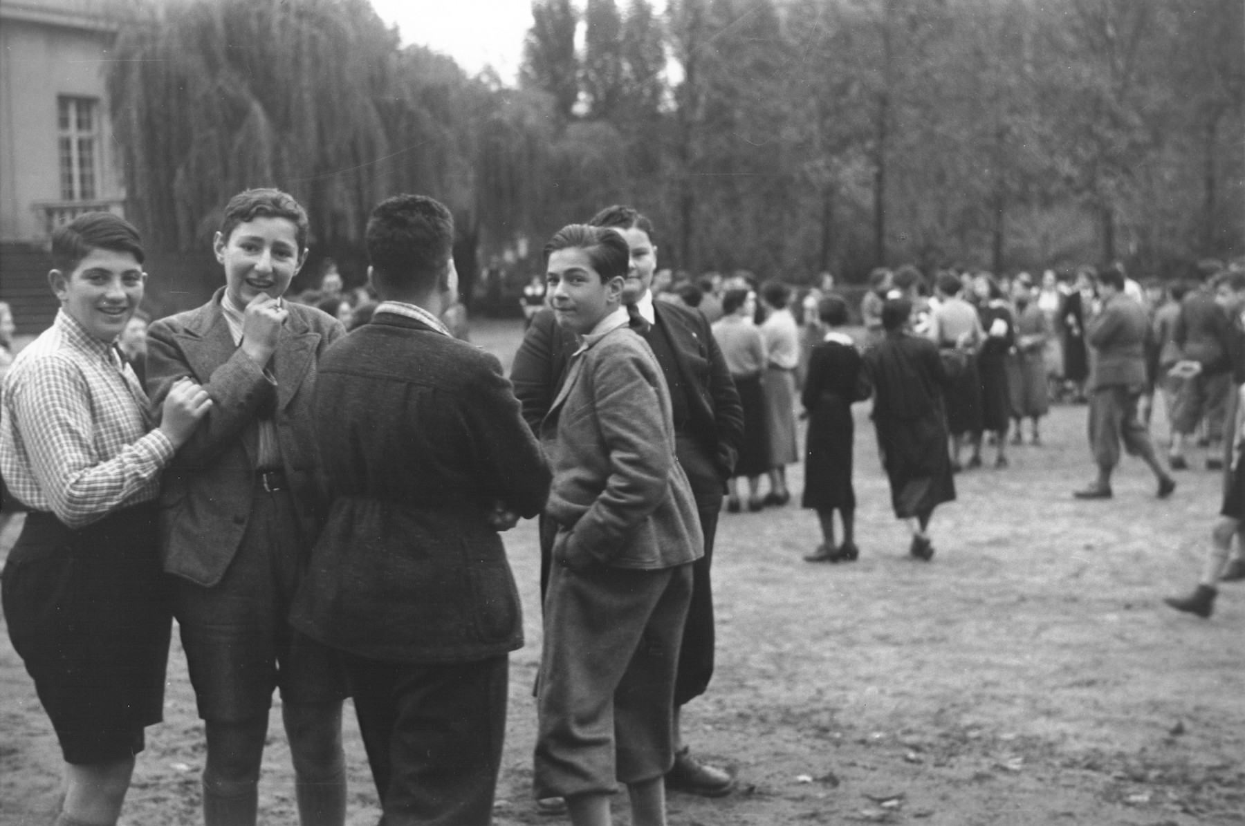A group of teenage boys stands outside on the grounds of the Goldschmidt Jewish private school in Berlin-Grunewald.