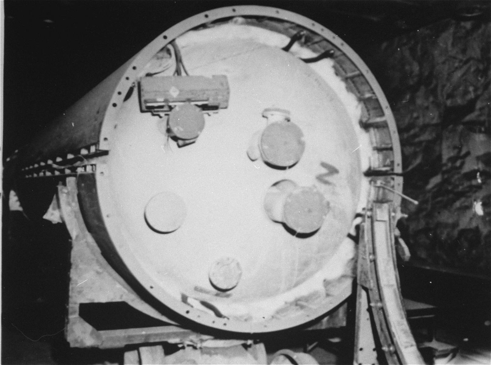 The center section, showing the oxygen tank, of a V-2 rocket in the underground rocket factory at Dora-Mittelbau.
