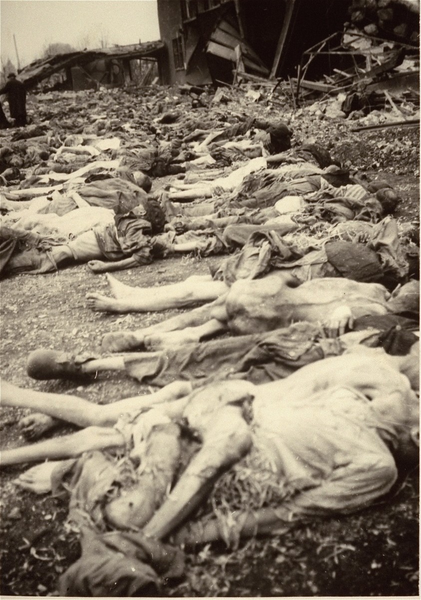 The bodies of prisoners lie on the ground in the newly liberated Nordhausen concentration camp.