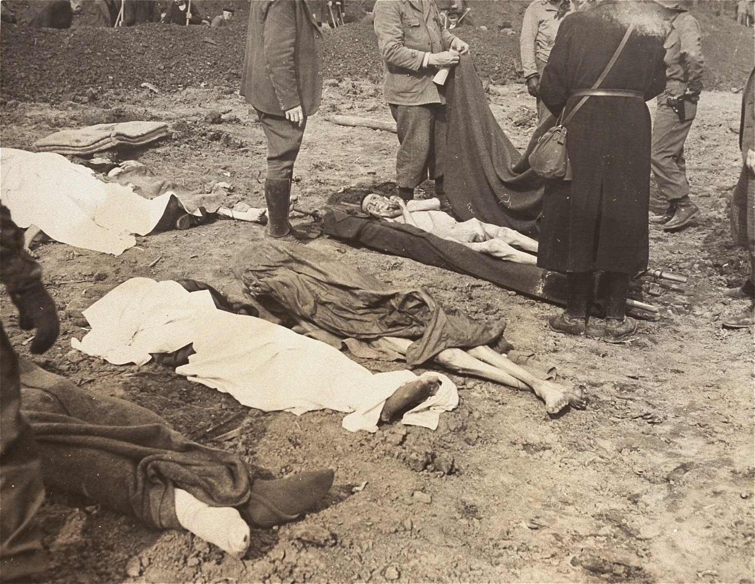German civilians from the nearby town of Nordhausen prepare the bodies of prisoners found at the Nordhausen concentration camp for burial.