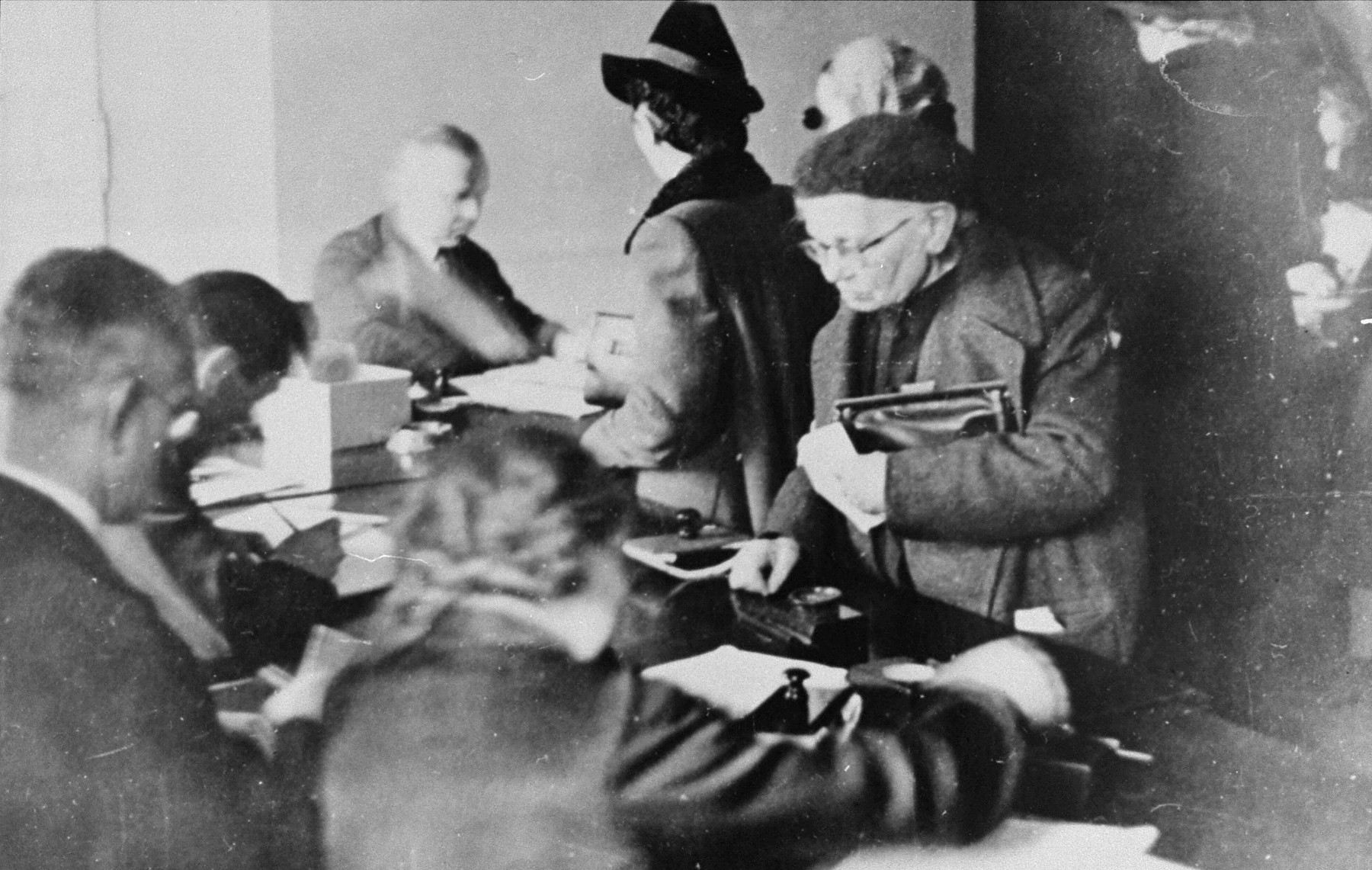 Jews register for identification papers and work permits in the offices of the Jewish Council in the Krakow ghetto.