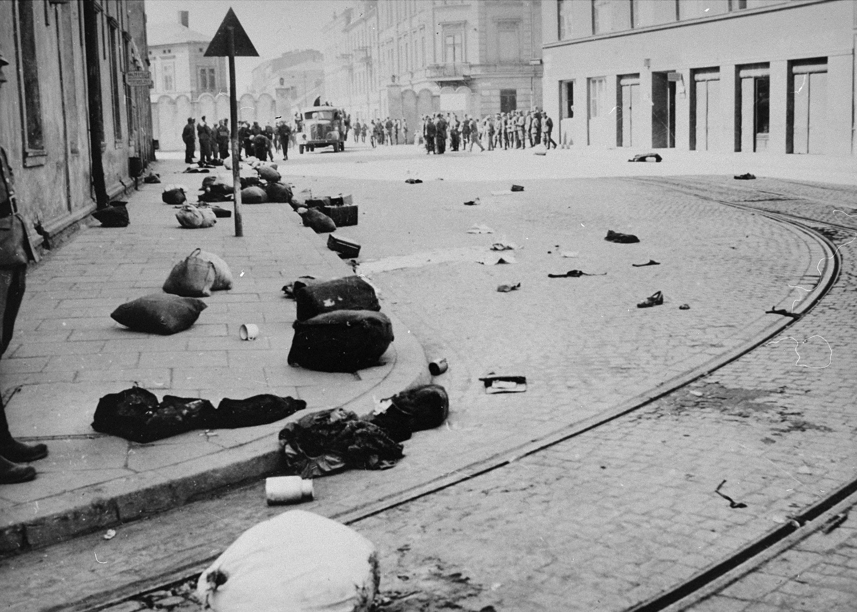 View of a major street in Krakow after the liquidation of the ghetto, which is strewn with the bundles of deported Jews.