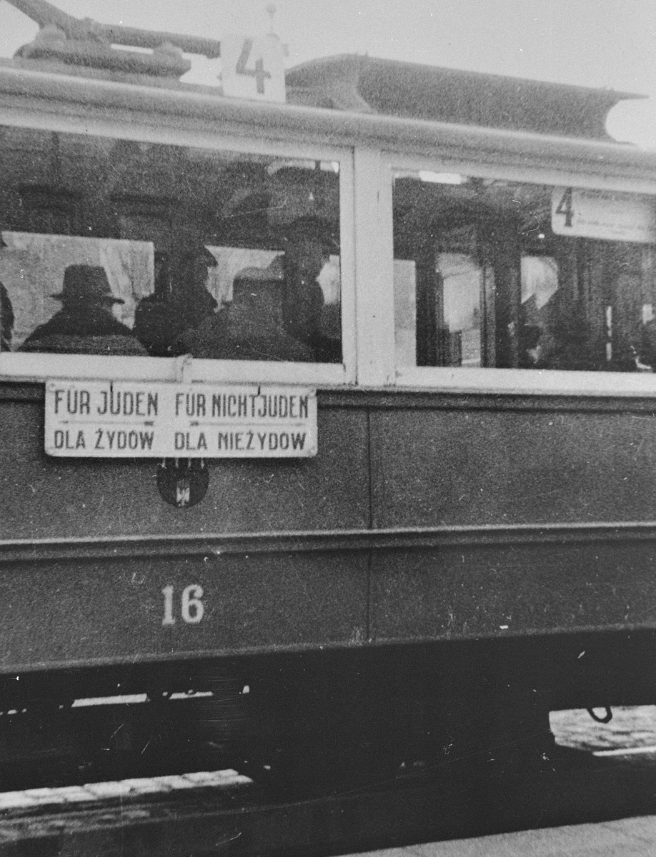 A segregated streetcar in Krakow.  The sign in German and Polish reads, "for Jews; for non-Jews."