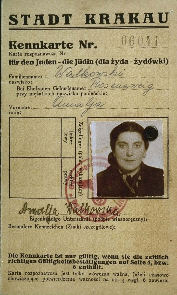 A photo identification card, bearing the official stamps of the Krakow labor office and the General Government, Krakow district, issued to the Polish Jew,  Amalja Rosenzweig Walkowski (the donor's sister). 

Amalja Walkowski perished in the Holocaust.
