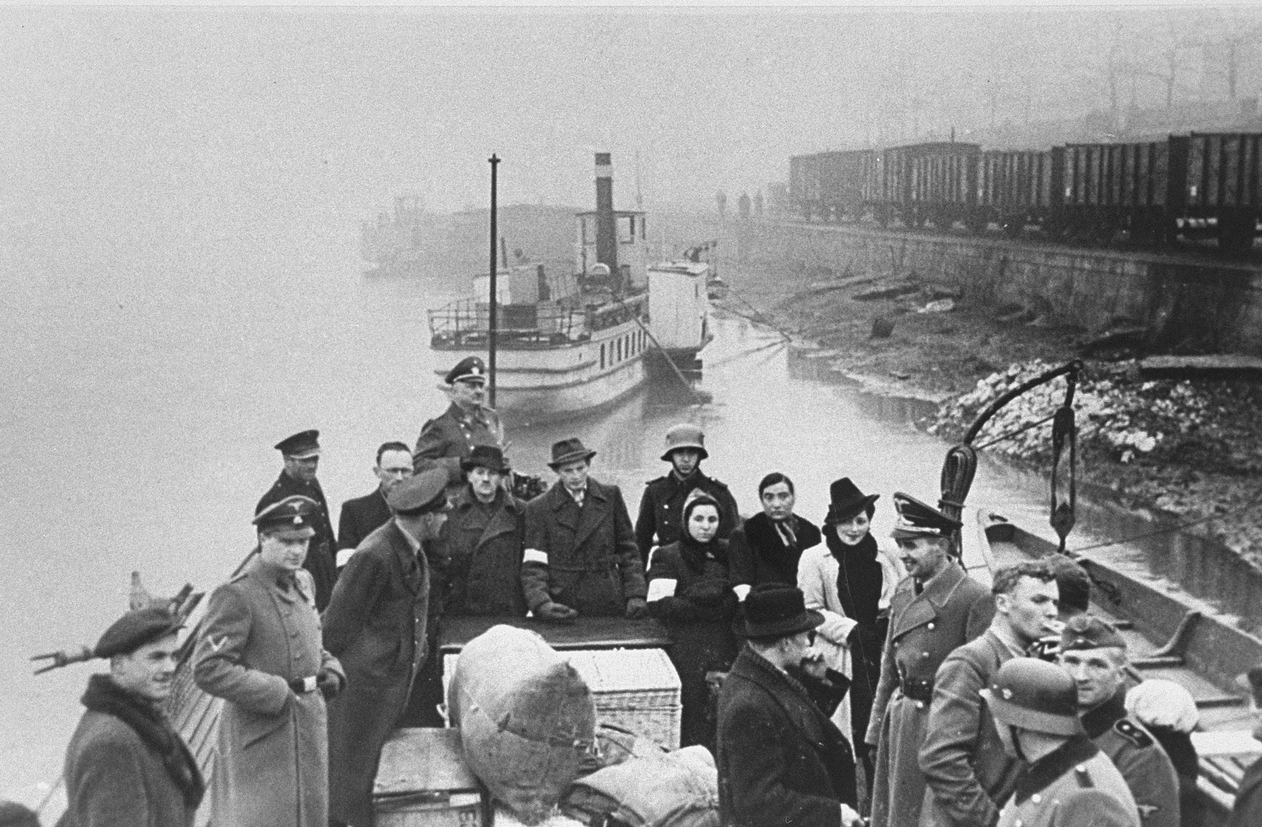 Jews are transported by ferry across the Vistula River for resettlement in the Krakow ghetto.