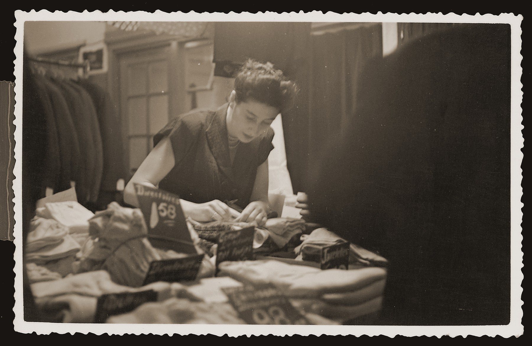 Bep Meijer working in the newly reopened Zion clothing and fabric store in Eibergen.
