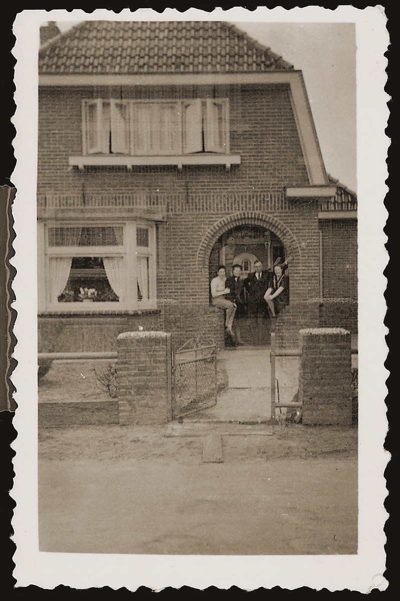 Bep Meijer and Gerta Sajet visit with the Leuverink family on the porch of their home.  The Leuverinks were members of the Dutch Reformed Church who hid Jews during the war and served in the local resistance movement.