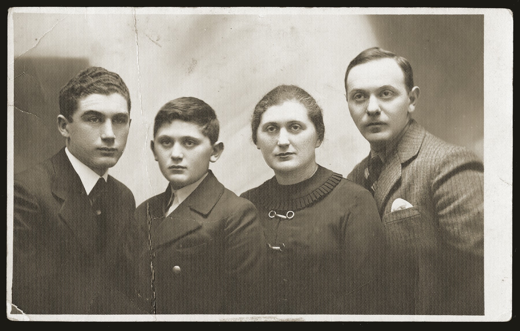 Portrait of the Liwer family in Bedzin.  

Pictured left to right are:  Efraim Mandel; Salek Liwer; Lonia Liwer; and Szmuel Liwer.