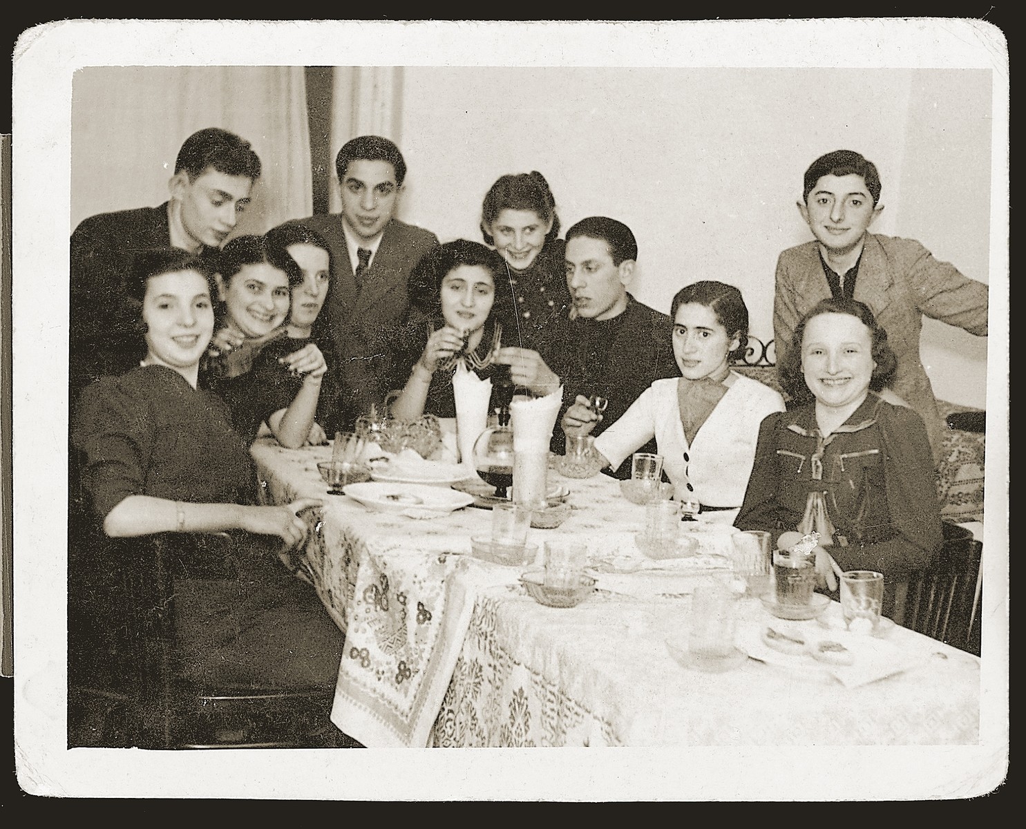 Itka Urman entertains friends in her home in Czeladz.

Standing at the head of the table is  Gary Kliman.