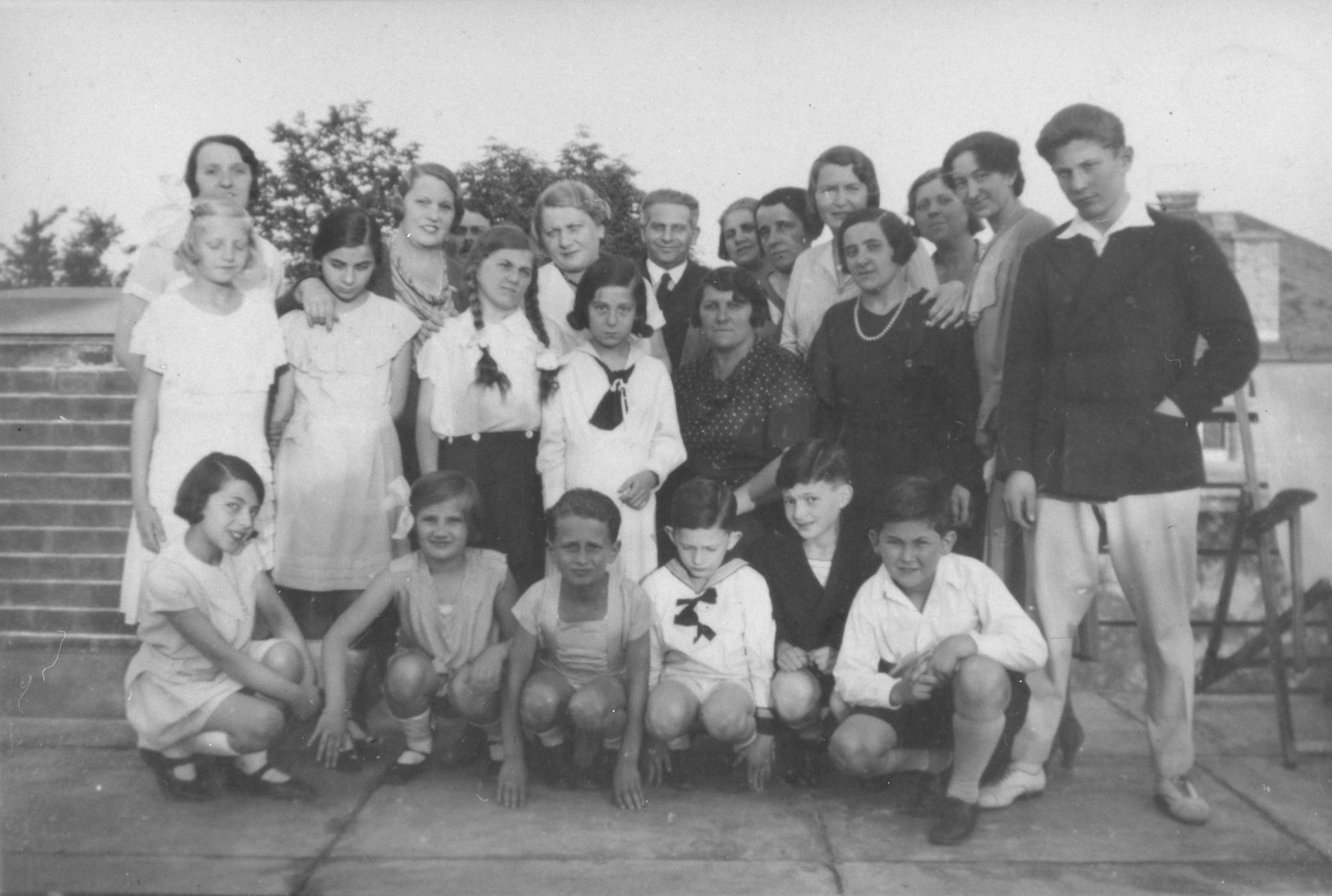 Members of the Veres family pose with friends at their summer home, where they are celebrating St. Stephen's Day.

Among those pictured are Thomas Veres (front row, right) and Berta Veres (seated in the middle of the second row).