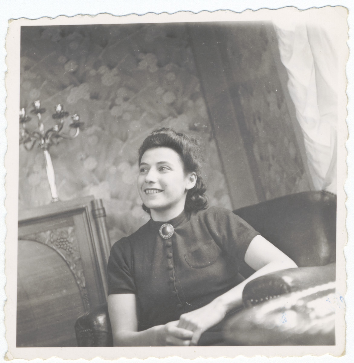 A woman sits in an apartment in Lyon.

Pictured is Liza Wolpert, the best friend of Alexander and Luba Fainas.  After she registered as a Jew, she was deported and killed.