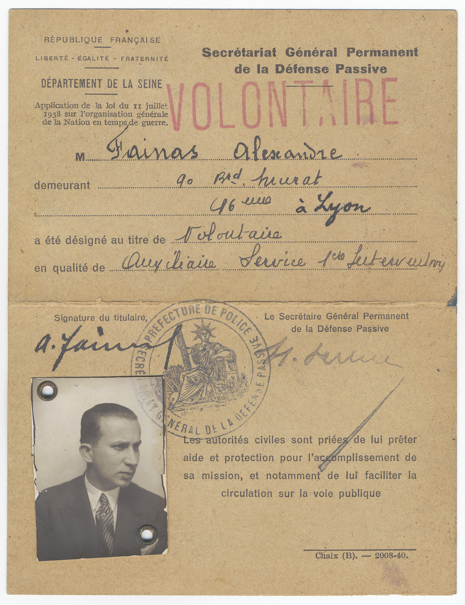 Volunteer card for the Defense Passive issued to Alexander Fainas.  

The card was probably issued to him when he volunteered to patrol to the streets and watch over people during the air raids at the start of the war.  It bears his address in Paris and was issued by the Departement de la Seine. However, someone later added the city "Lyon" to the address [perhaps to give Alexander Fainas the extra cover of a semi-official capacity while in hiding in Lyon].