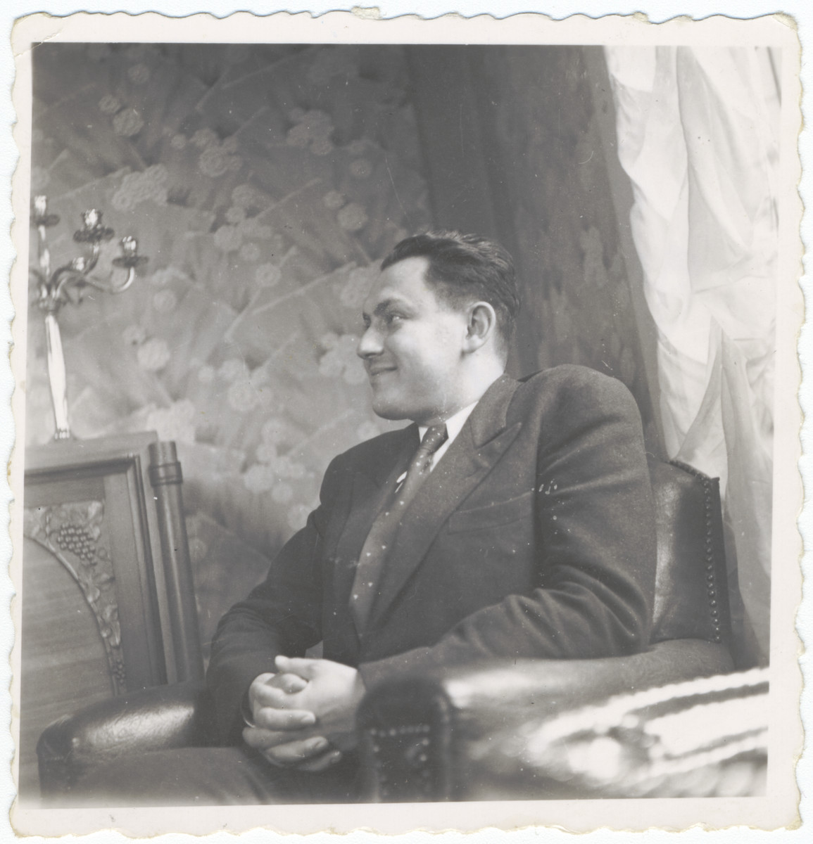 A Jewish man sits in an apartment in Lyon.

Pictured is Maurice (Henryk) Wolpert, the best friend of Alexander Fainas.  After he registered as a Jew, he was deported and killed.