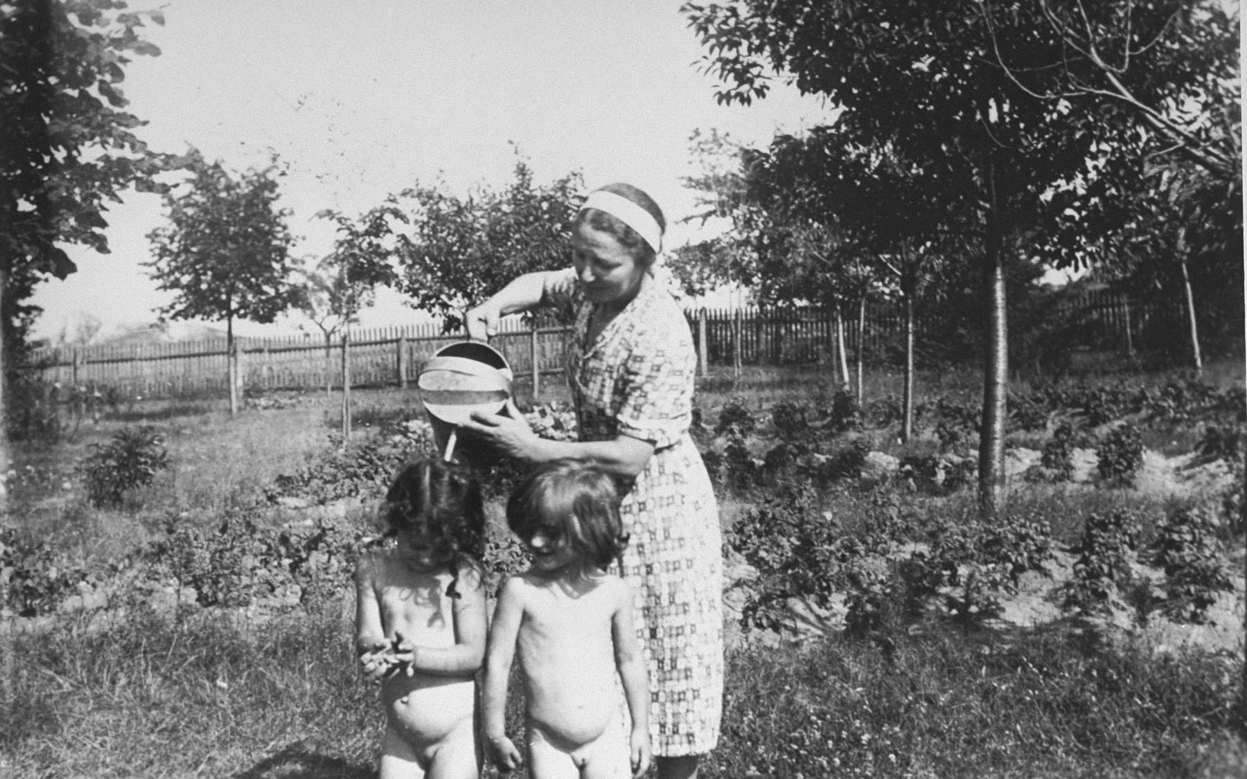 Stefania Minc cares for her twin grand daughters while the family was in hiding.