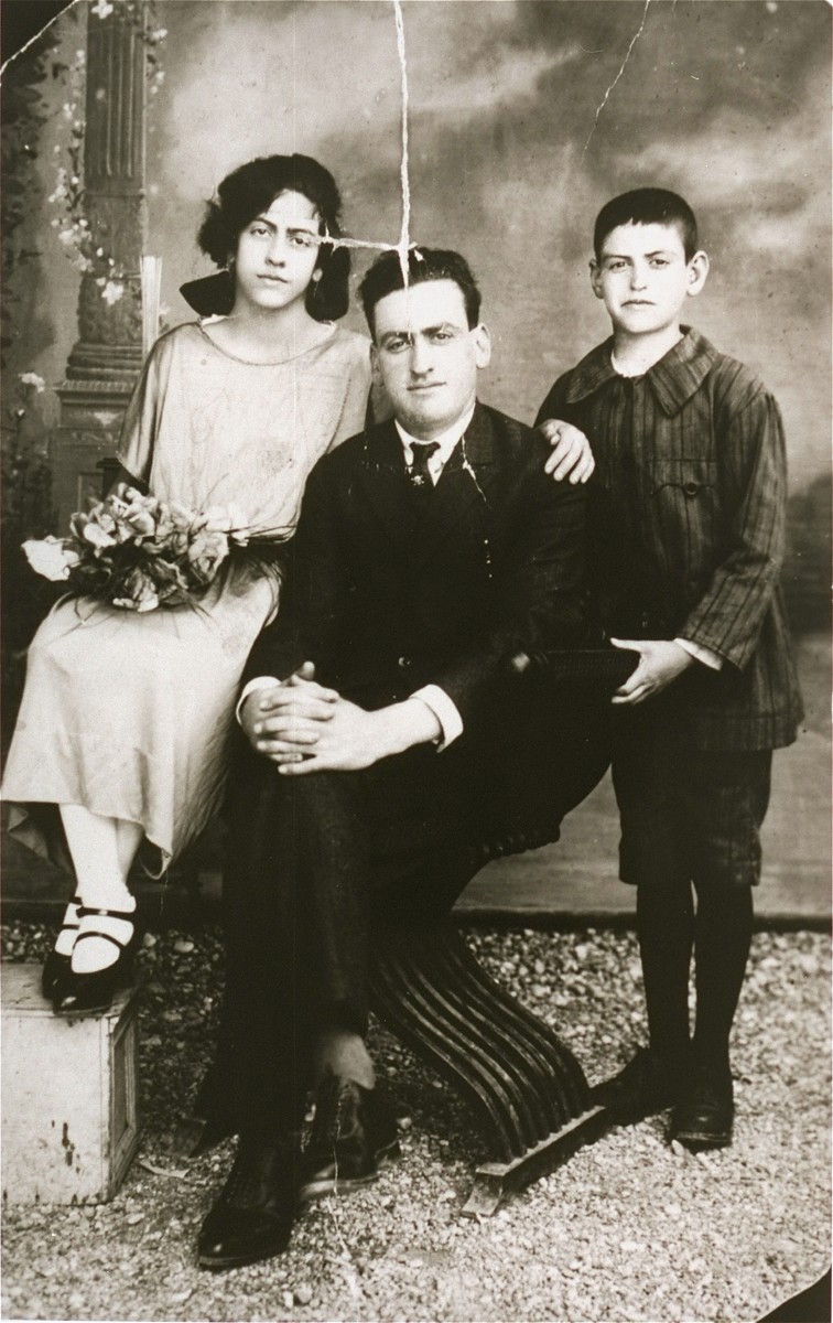 Portrait of the Hasson family in Rhodes. 
 
Pictured from left to right are: Violeta, Celebi, and Shlomo Hasson.  All three were deported to Auschwitz in 1944, where they perished.