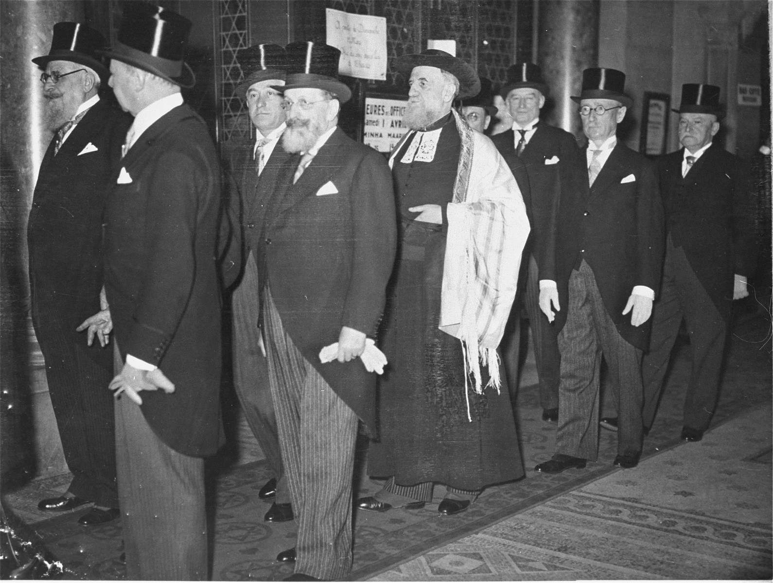 Rabbi Isaie Schwartz is escorted by leaders of the Jewish community to the synagogue where he will be installed as the new Chief Rabbi of France.