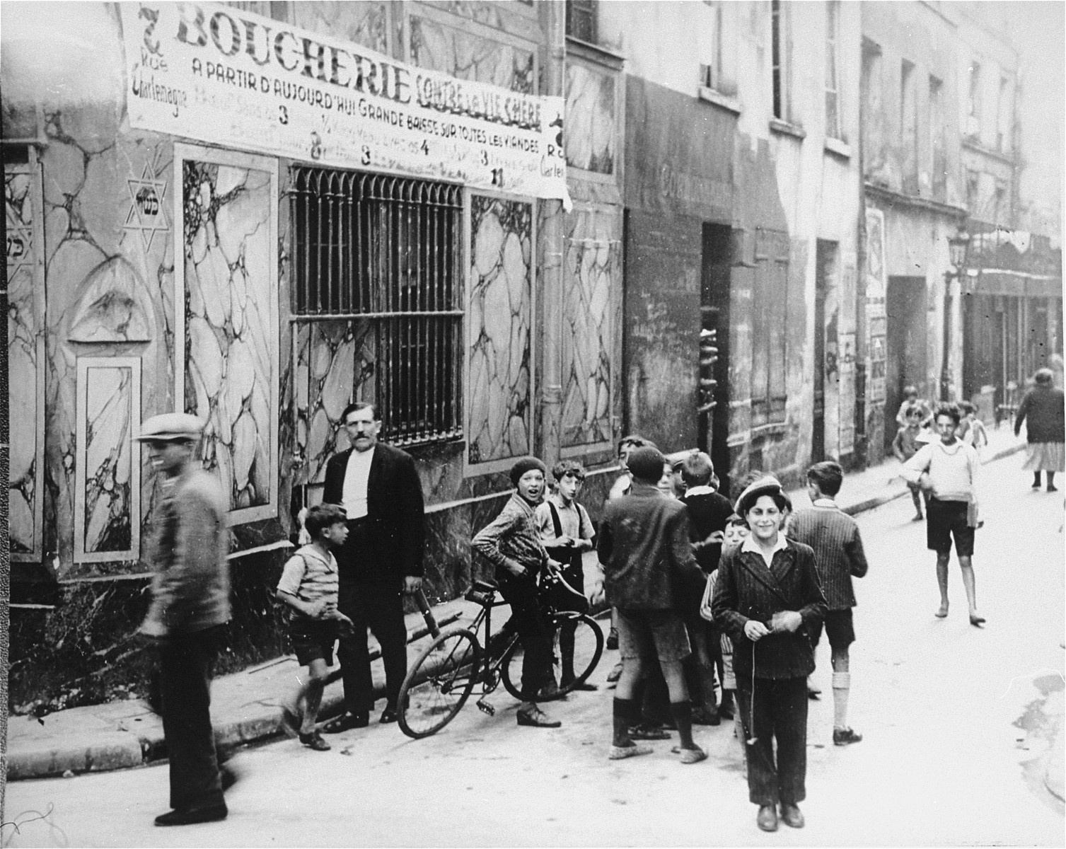 Children playing on a street in the Jewish quarter of Paris.