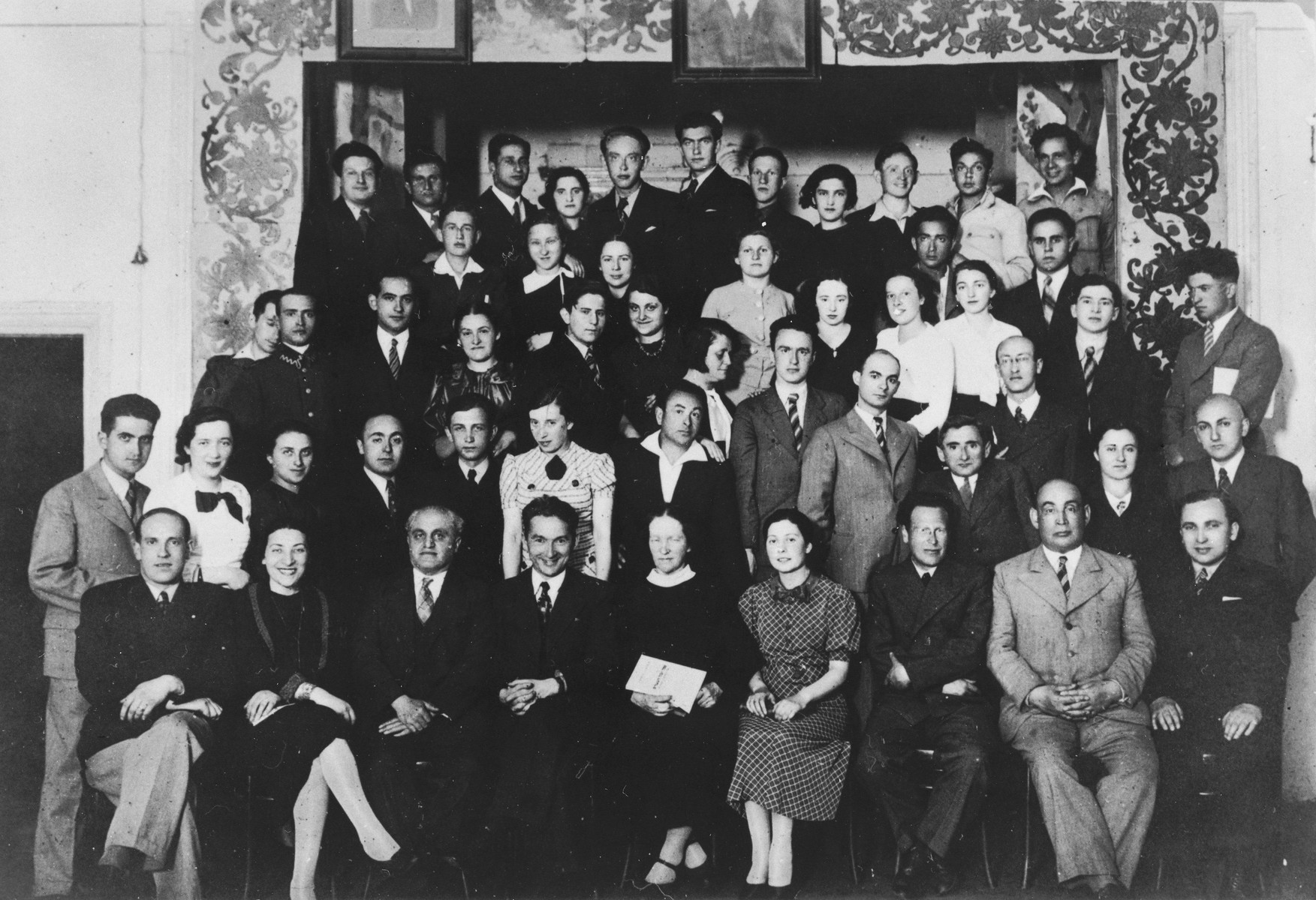 Group portrait of the alumni of the Hebrew language Tarbut school in Vilna taken on the twentieth anniversary of the Hebrew gymnasium.  

Among those pictured is Ralph Denishevsky (front row, left).