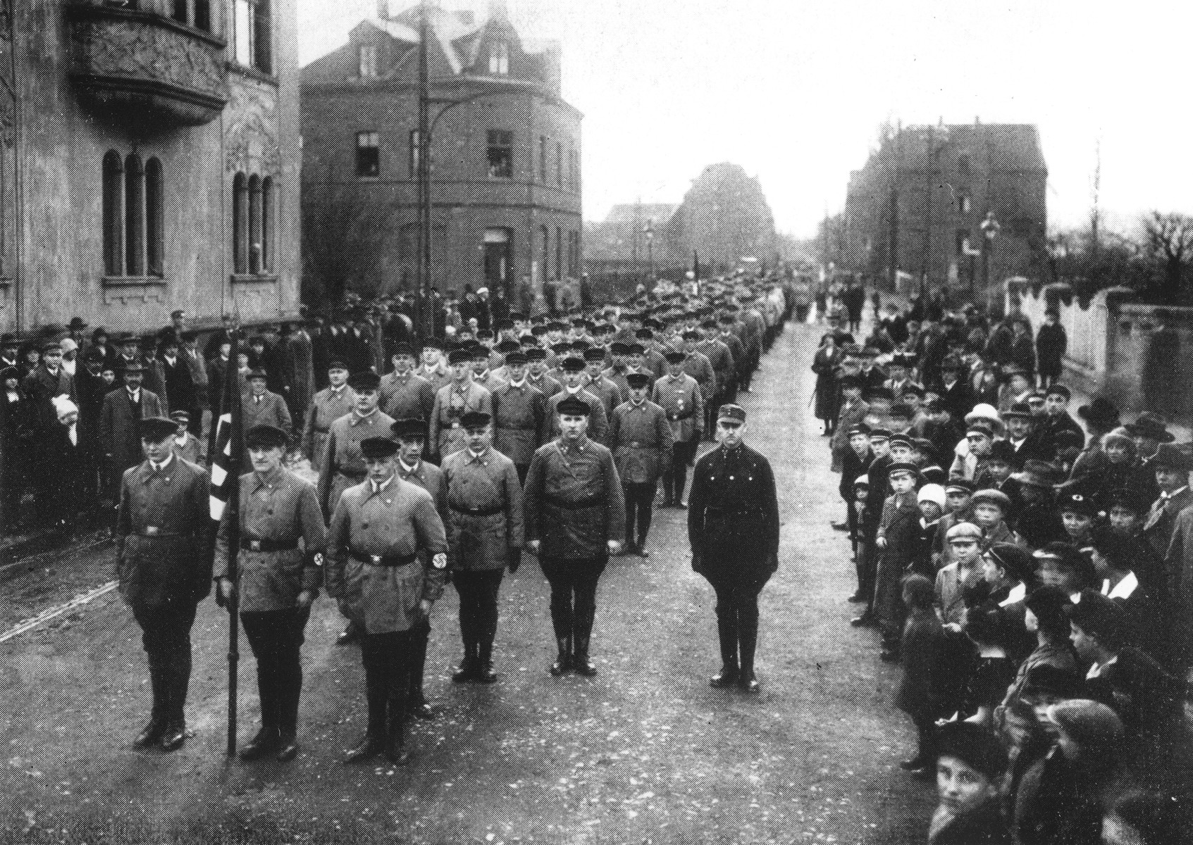 Local residents line the streets during an SA march in an unidentified German town.