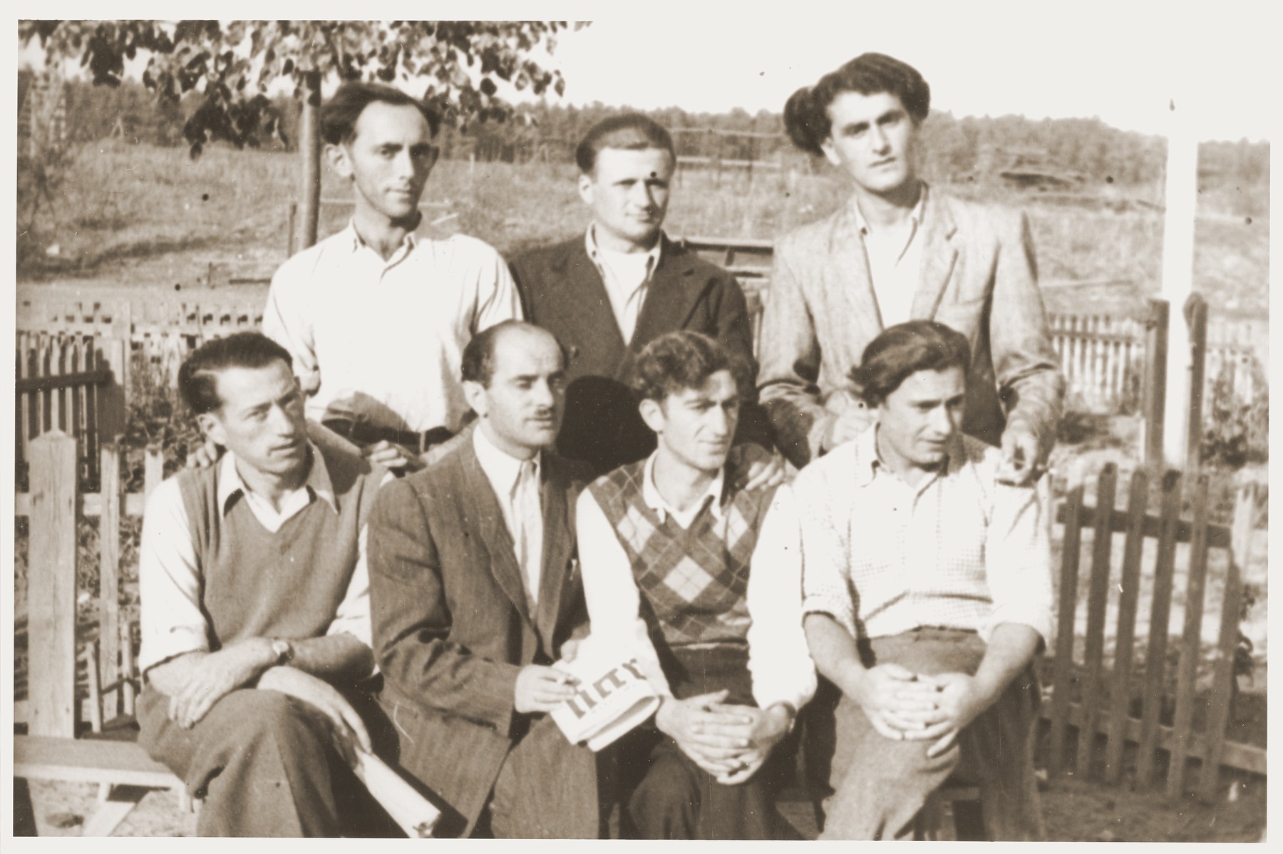 Group portrait of members of the Kibbutz Nili hachshara (Zionist collective) in Pleikershof, Germany.  

Among those pictured is Noach Miedzinski (front row, second from the left).  Pictured in the front row, far right is Mendel Gersztenblut (later Max Gersten).