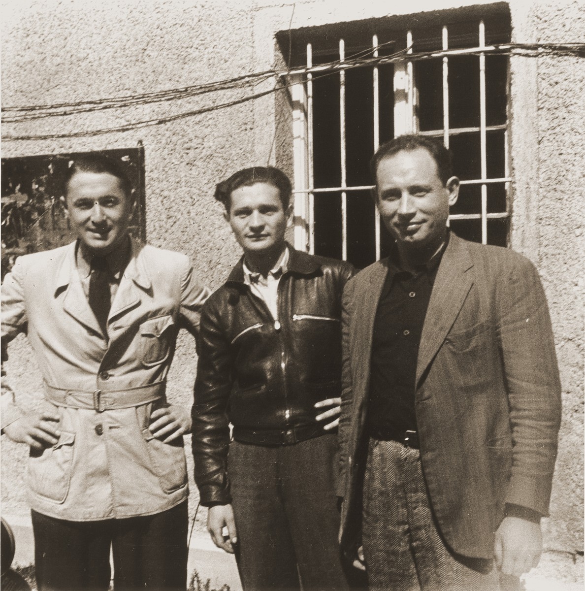 Three Jewish DPs, who survived both the Kovno ghetto and Dachau concentration camp, pose together at the Saint Ottilien Hospital displaced persons camp.  

On the left is Max Lurie.
