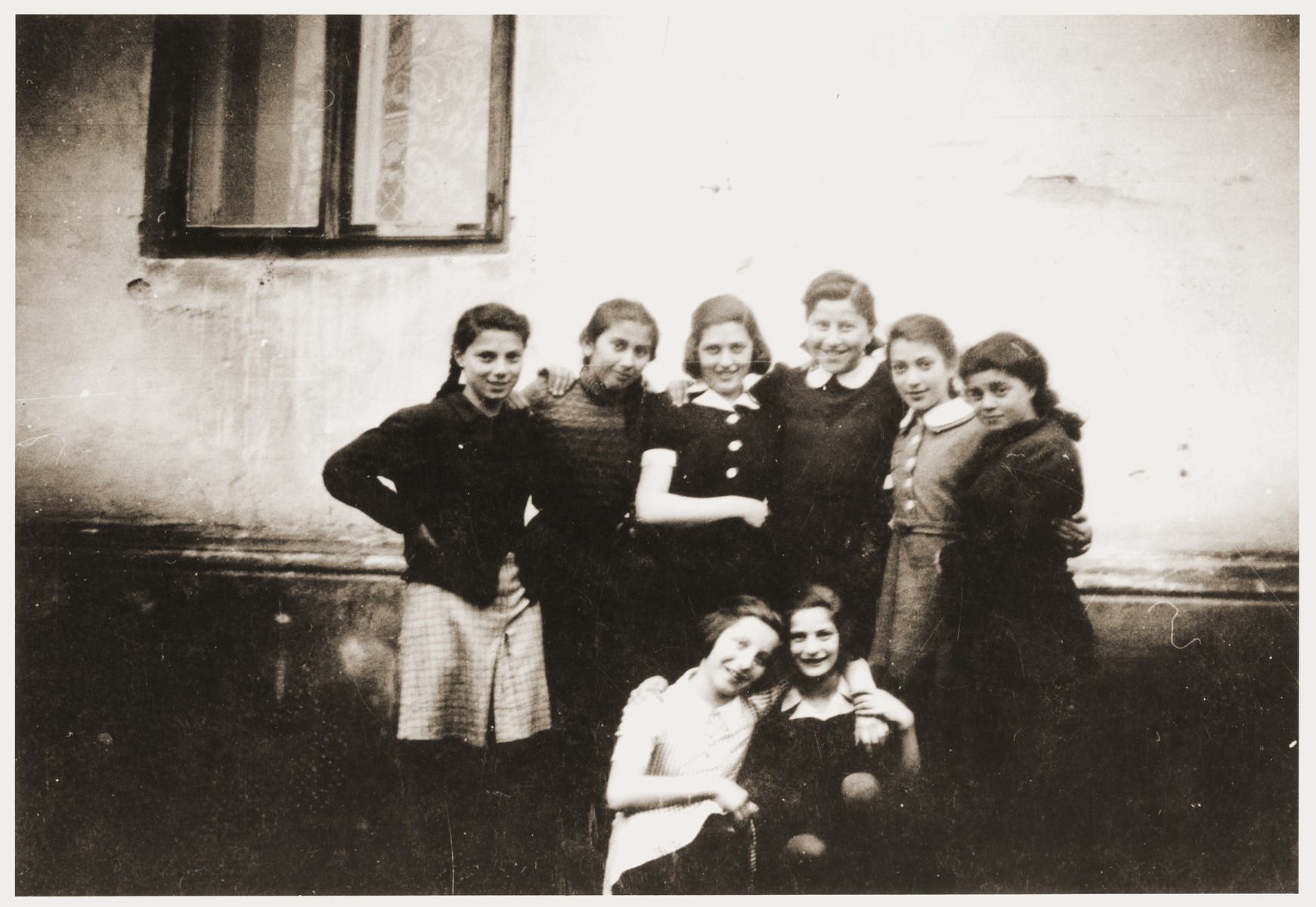 Group portrait of Jewish girls in the Zabno ghetto taken on the occasion of the twelfth birthday of Hania Goldman.

Among those pictured are Hania Goldman (bottom left) and her sister, Rachela (standing third from the right).