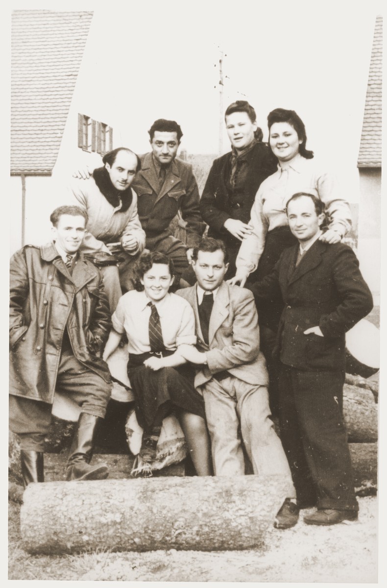 Group portrait of members of the Kibbutz Nili hachshara (Zionist collective) in Pleikershof, Germany.  

Among those pictured is Nussia Applebaum (front row, center) and Noach Miedzinski (top row, left).