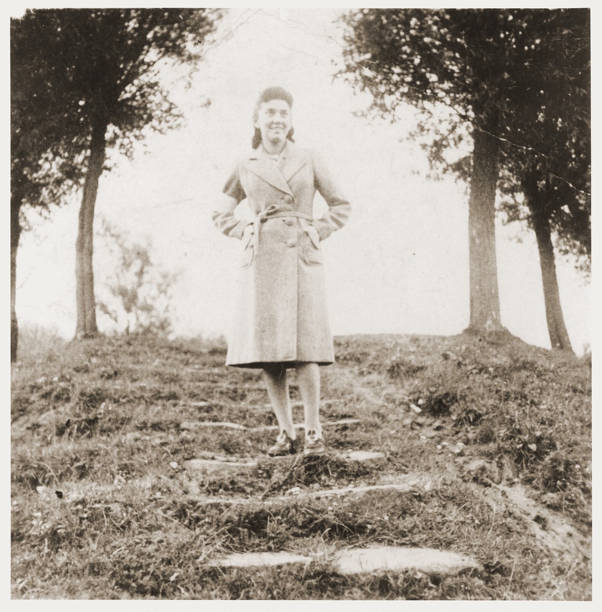 A Jewish girl, wearing an armband, poses in a park in Zabno.  

Pictured is Ms. Meyerhof, the daughter of a hardware store owner in Zabno.  She did not survive.